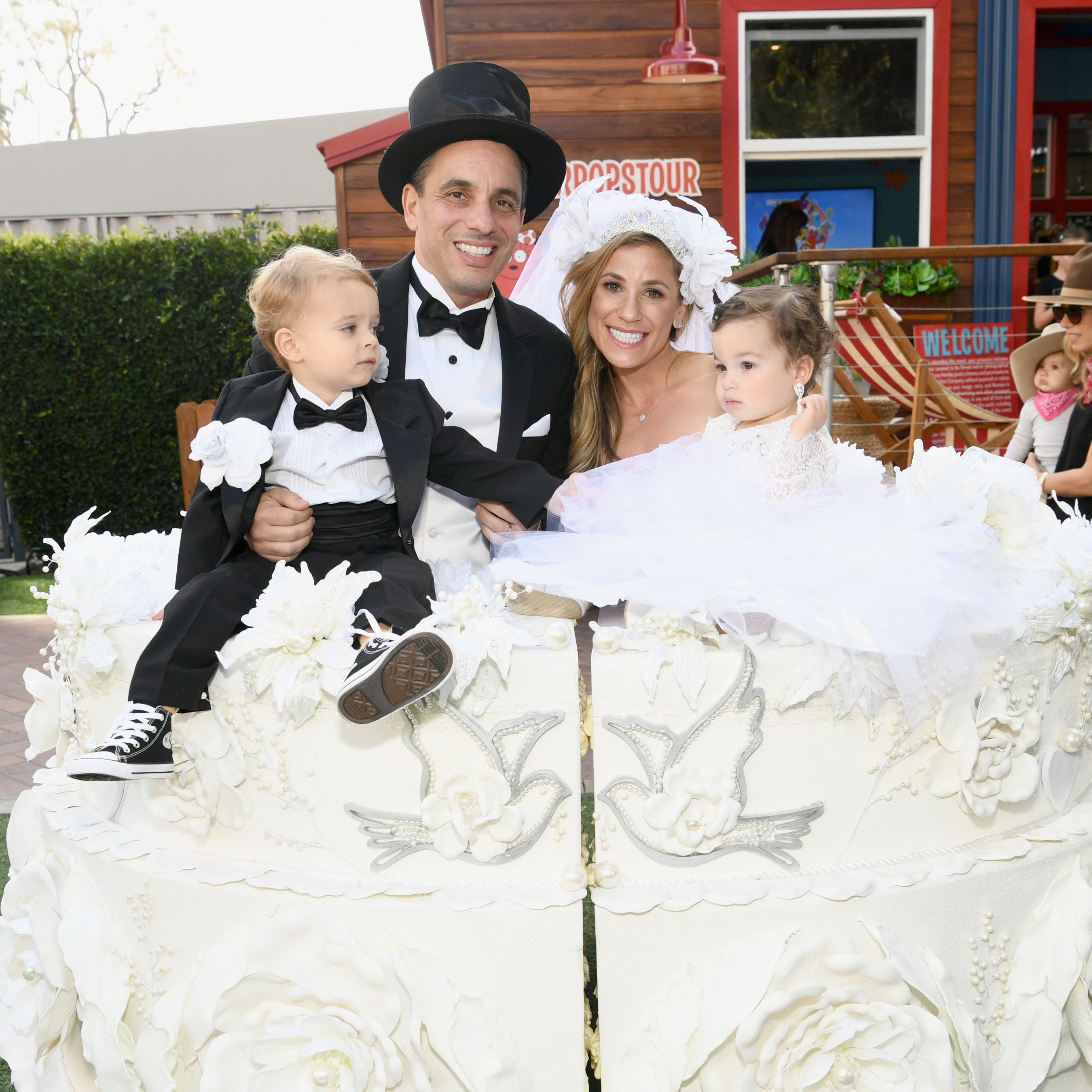 Sebastian Maniscalco and his wife Lana Gomez with their son and daughter at the 2018 GOOD+ Foundation's Annual Halloween Party on October 28, 2018, in California. | Source: Getty Images