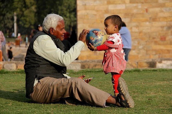 A Grandfather plays with his Grandson | Photo: Getty Images