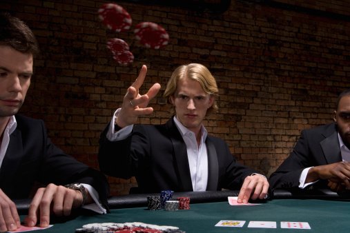 Photo of man throwing poker chips in a casino | Photo: Getty Images