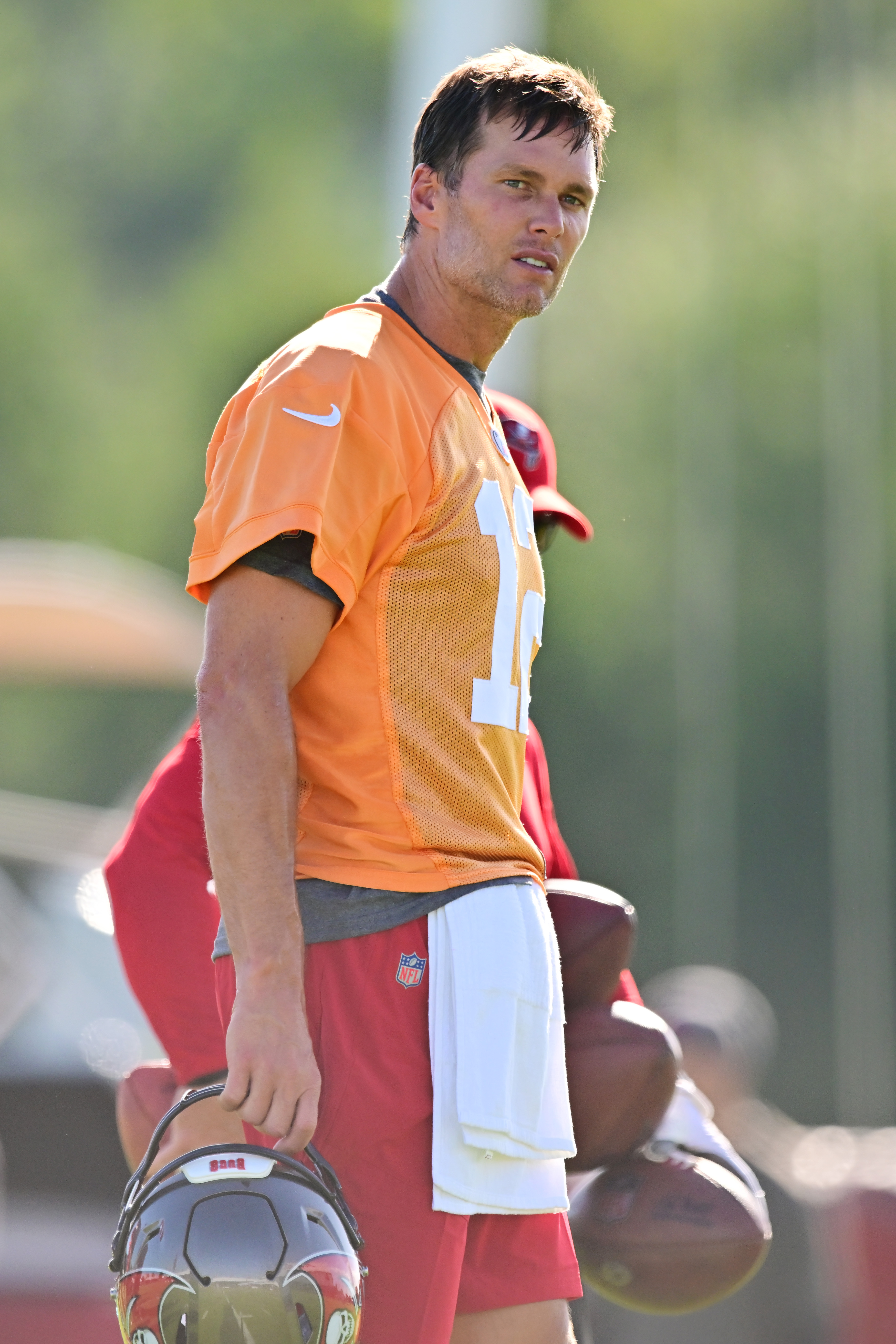 Tom Brady #12 of the Tampa Bay Buccaneers looks on during the 2022 Buccaneers Training Camp at AdventHealth Training Center on July 27, 2022 in Tampa, Florida. | Source: Getty Images