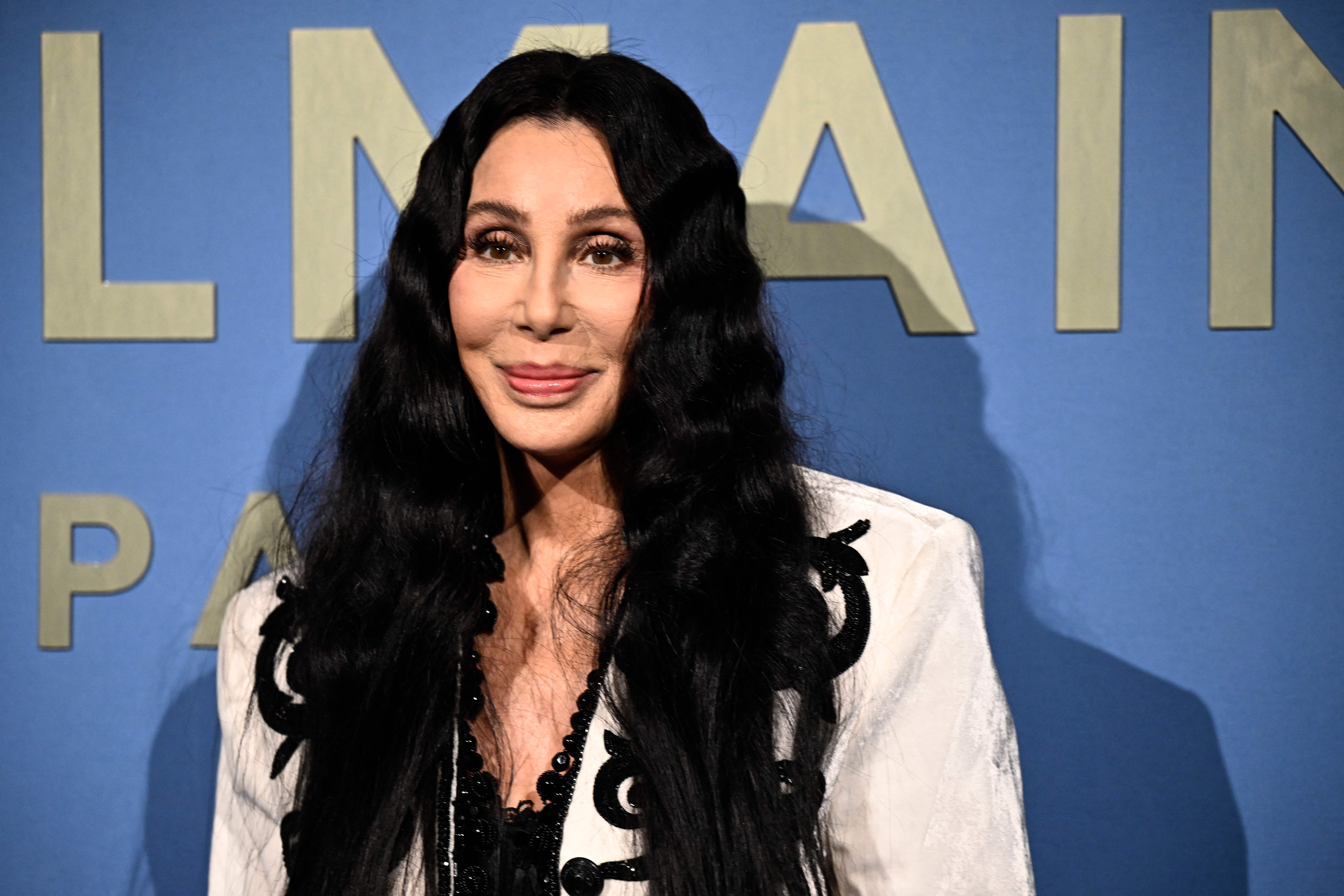 Cher poses during a photocall ahead of the Balmain show as part of the Paris Fashion Week Womenswear Spring/Summer 2024, in Paris on September 27, 2023. | Source: Getty Images