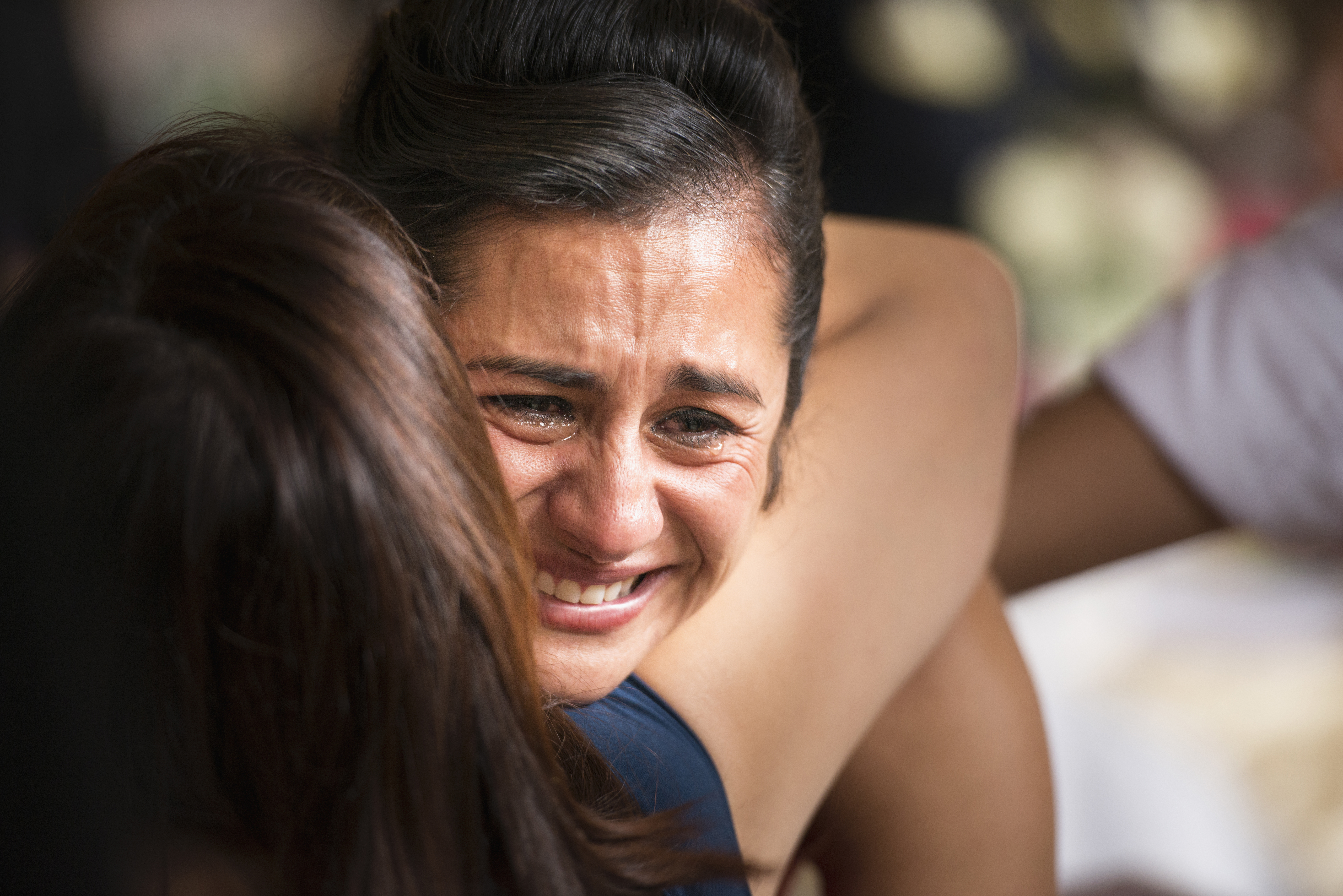 A woman hugging another crying woman | Source: Getty Images