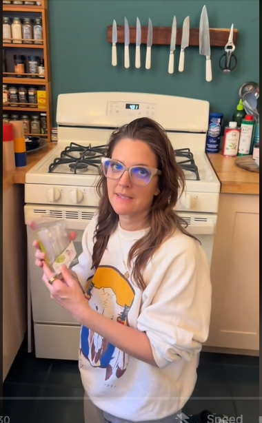 Drew Barrymore arranging her kitchen from a TikTok post dated April 16, 2024 | Source: Tiktok/@drewbarrymore