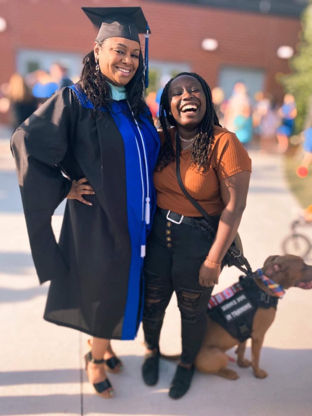 Riziki Ilenre and her dog, Chief, with Pastor Walter D'Andre Green's wife Shawnnetta Green, from a post dated December 14, 2025 | Source: Facebook/Walter D'Andre Green