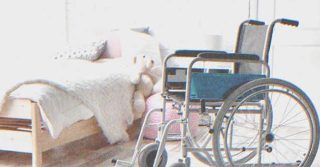 A wheelchair beside a child's bed. | Source: Shutterstock