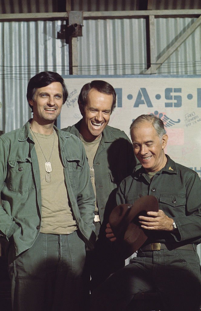 Portrait of American actors, from left, Alan Alda, as Captain Benjamin Hawkeye Pierce, Mike Farrell, as Captain B.J. Hunnicut, and Harry Morgan, as Colonel Sherman T. Potter, on the television show, California, circa 1981. | Photo: Getty Images