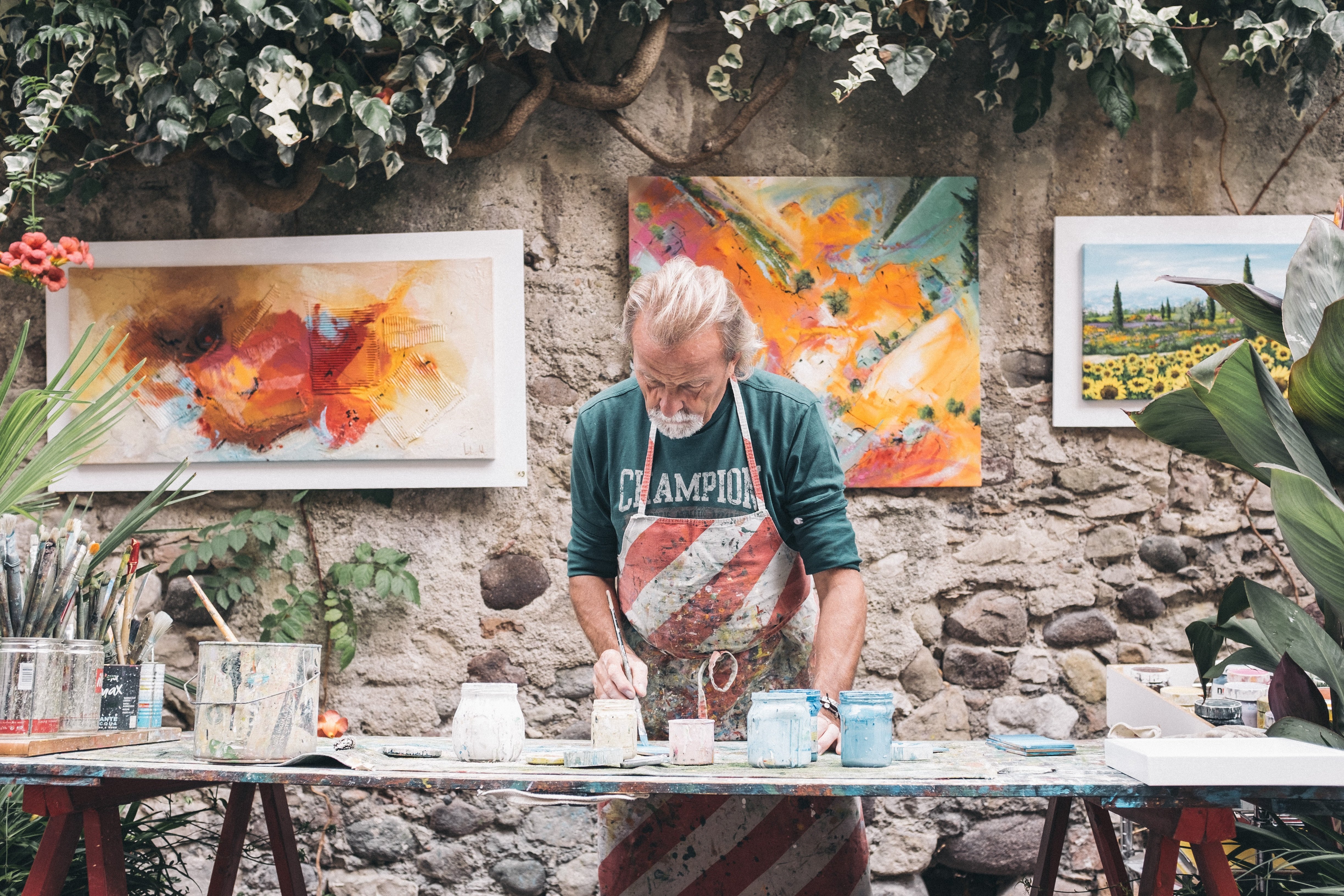 An artist slaving over a painting | Source: Unsplash.com