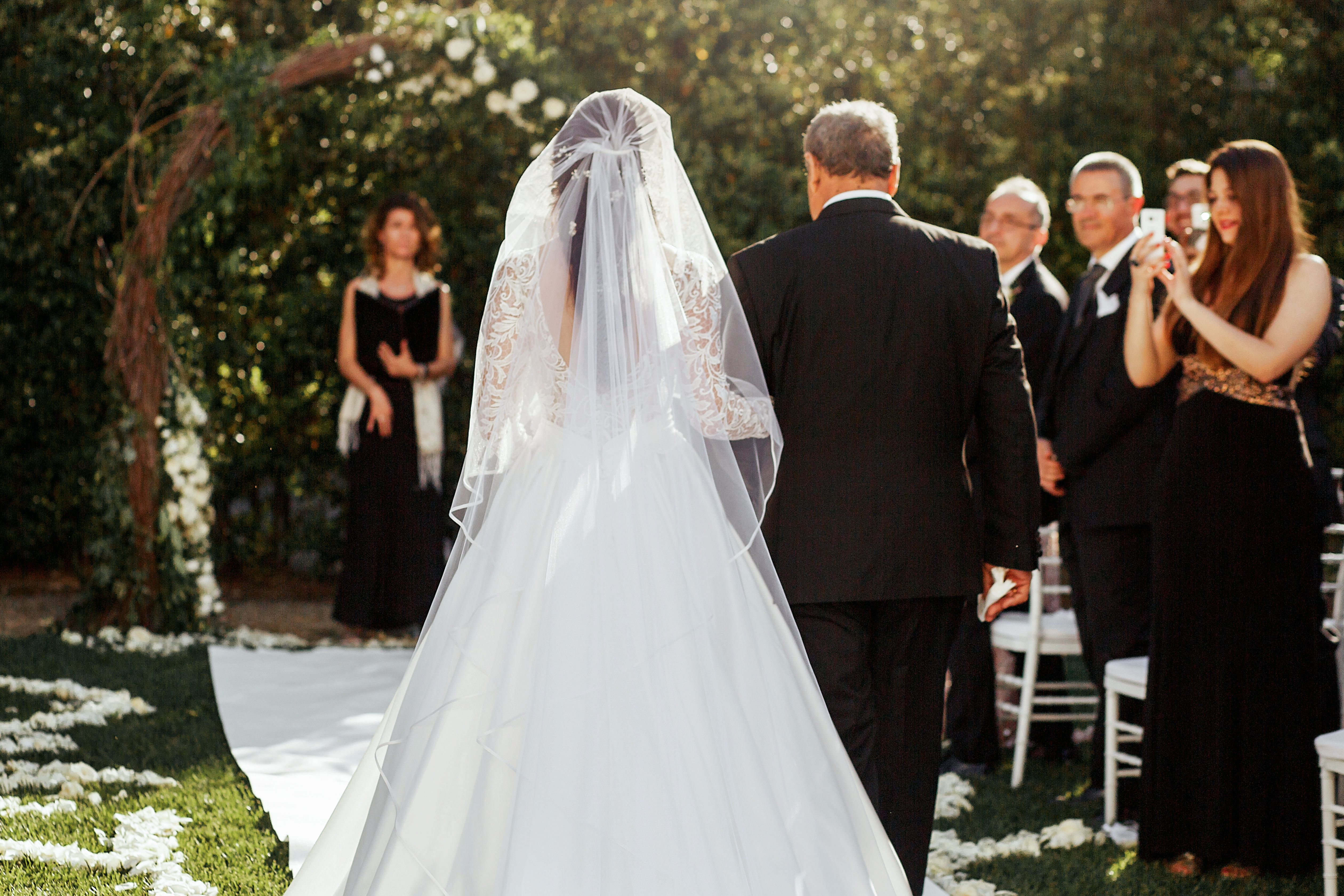 Father walking his daughter down the aisle on her wedding day | Source Shutterstock