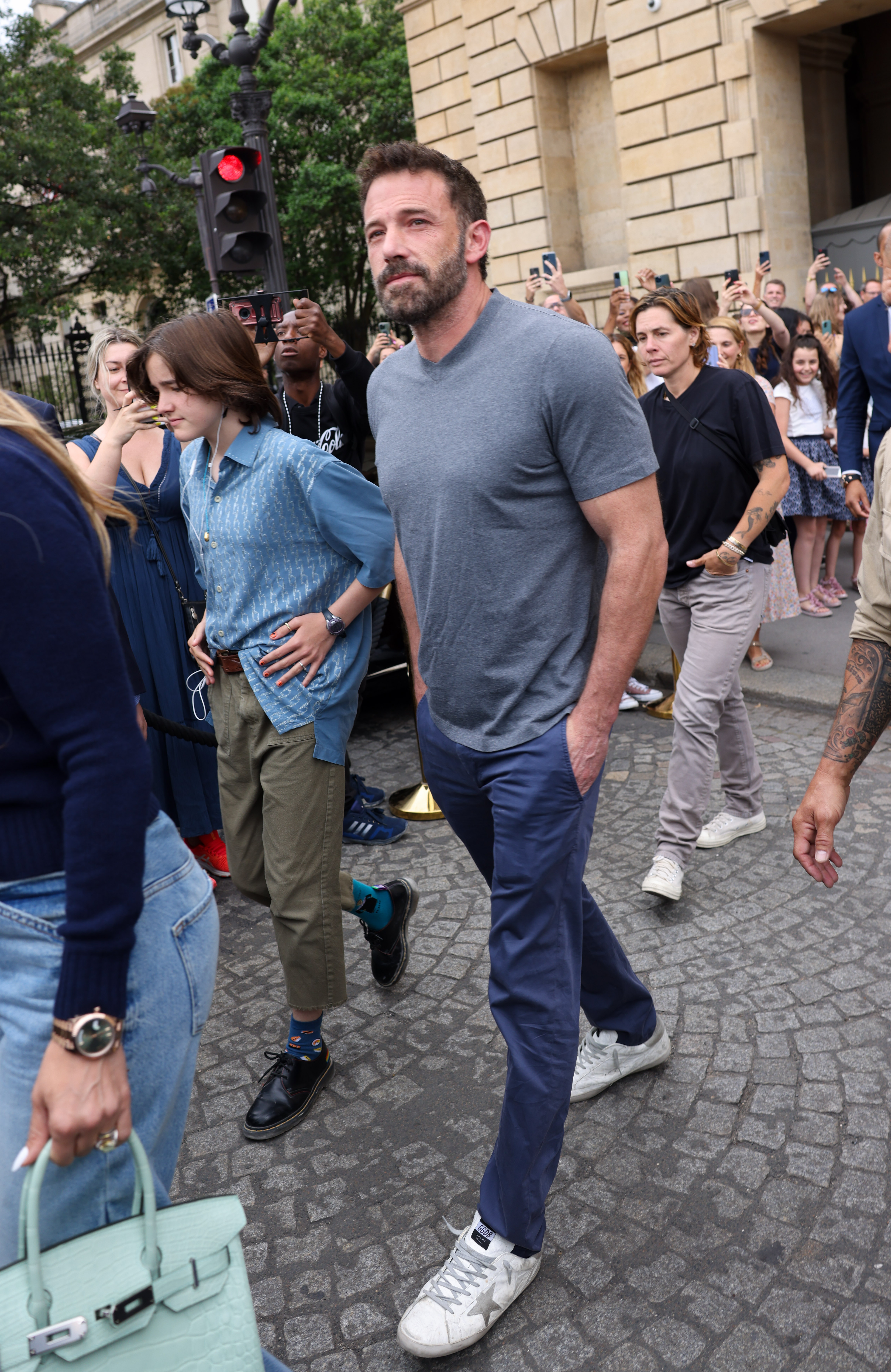 Ben Affleck and Fin step out together in Paris on July 26, 2022, one day after they were photographed leaving their hotel. Although the outfit had changed, Fin's relaxed style remained a consistent part of the appearance. | Source: Getty Images