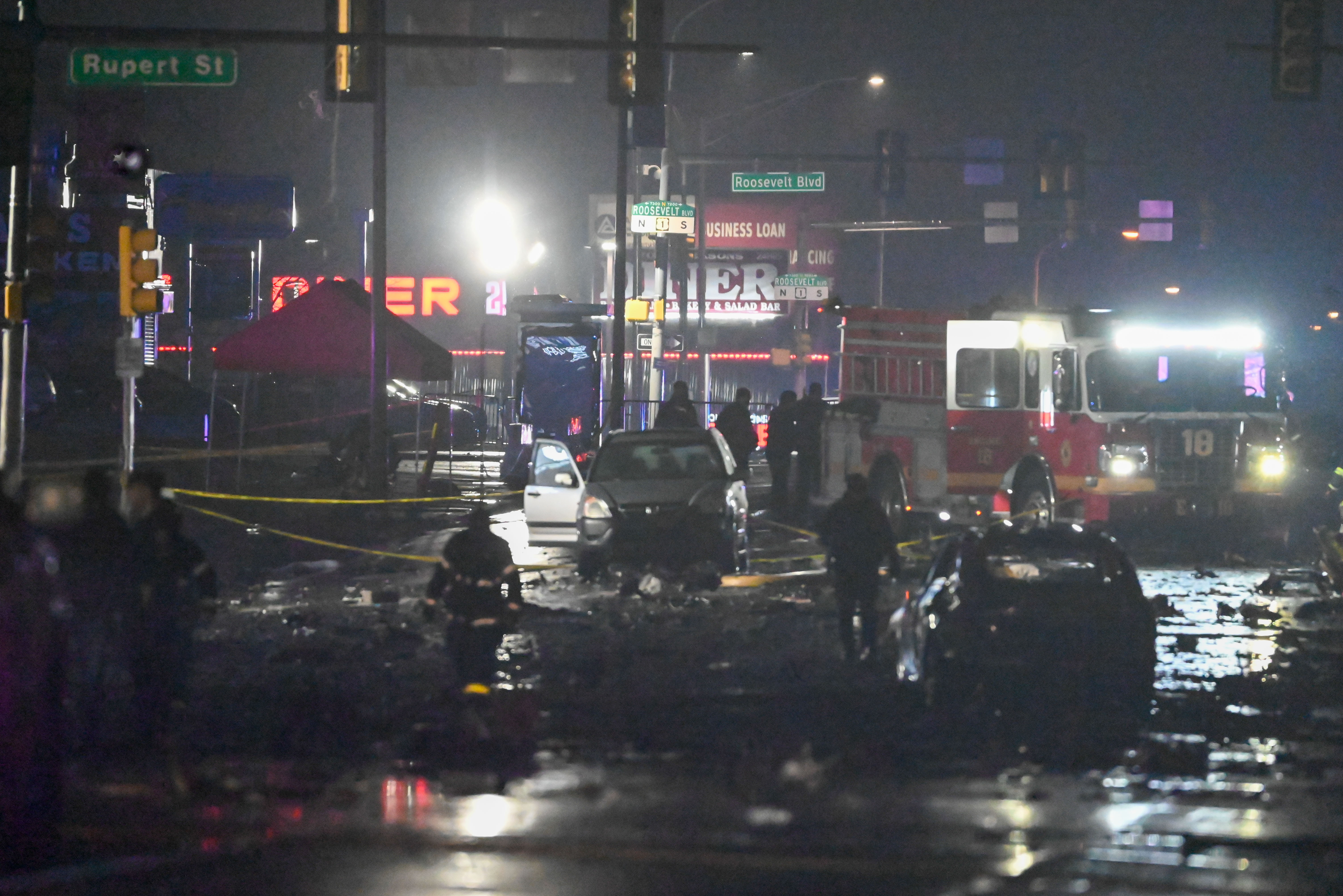 A view of the scene as the aftermath of destruction is seen in front of the Roosevelt Mall and a large debris field is seen with cars destroyed and structures damaged after a small plane crashed in Philadelphia, Pennsylvania, on February 1, 2025 | Source: Getty Images