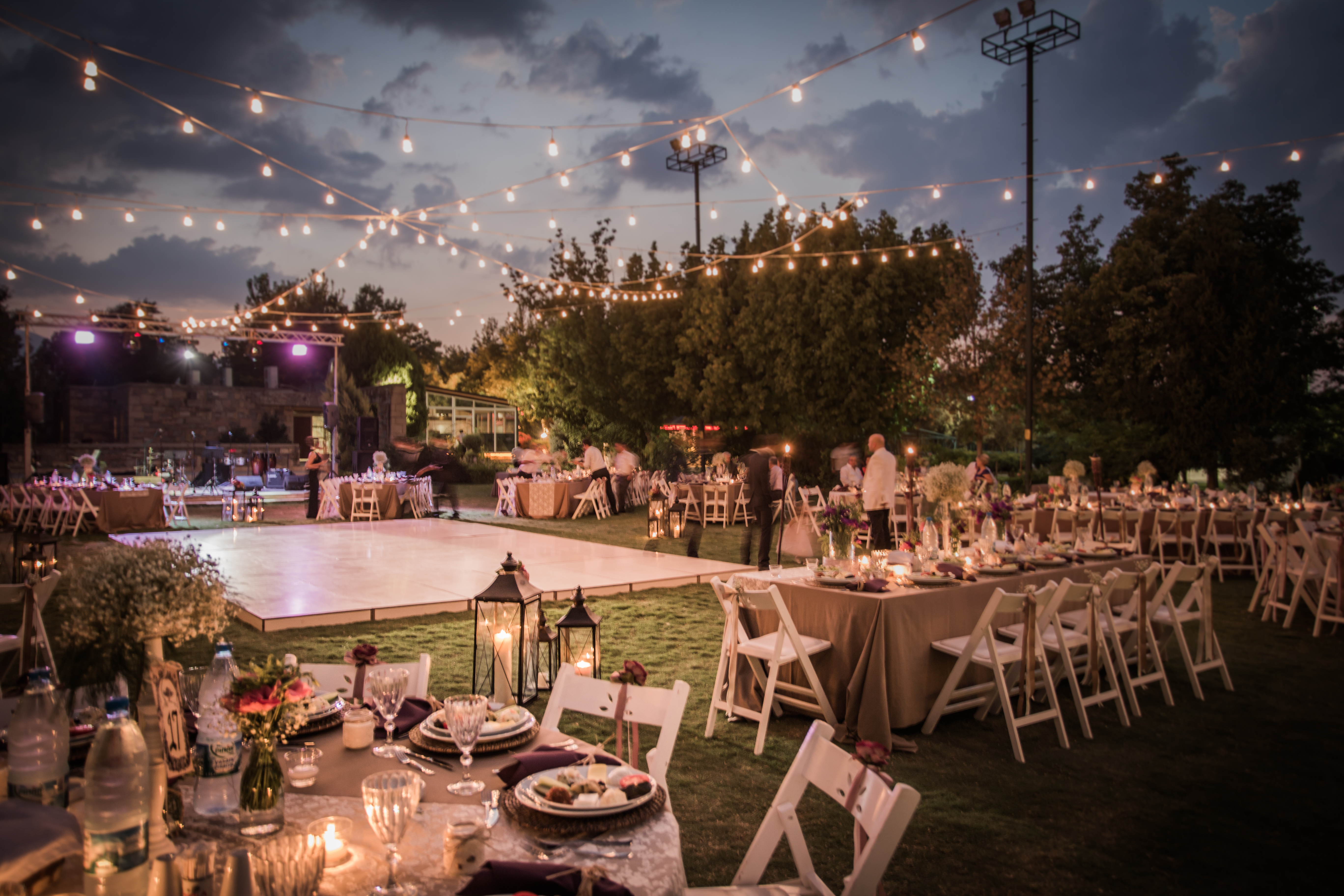 A wedding reception set with twinkling lights and tables | Source: Shutterstock