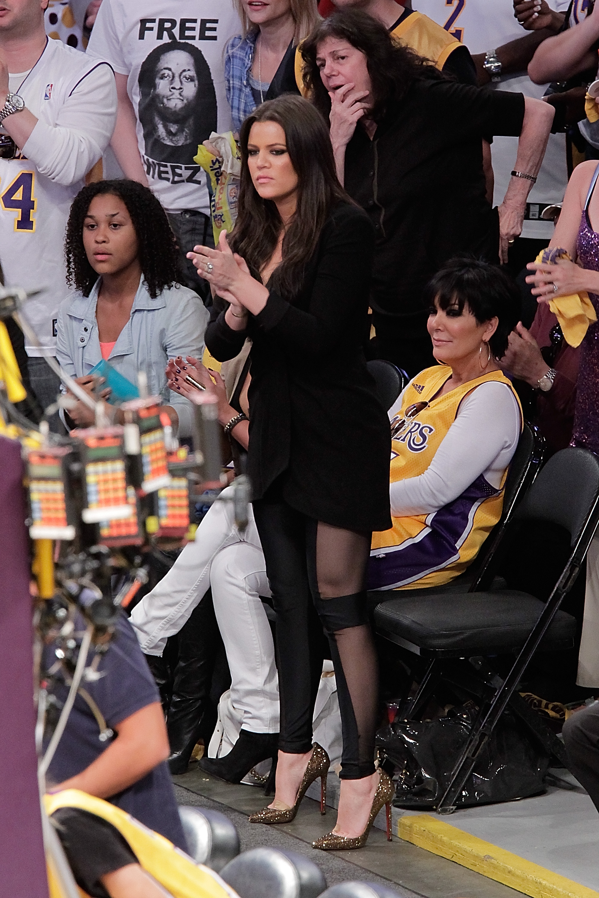 Destiny Odom (L), Khloe Kardashian (C) and Kris Jenner (R) attend Game Seven of the NBA playoff finals between the Boston Celtics and the Los Angeles Lakers during the 2010 NBA Playoff at Staples Center, on June 17, 2010, in Los Angeles, California.| Source: Getty Images
