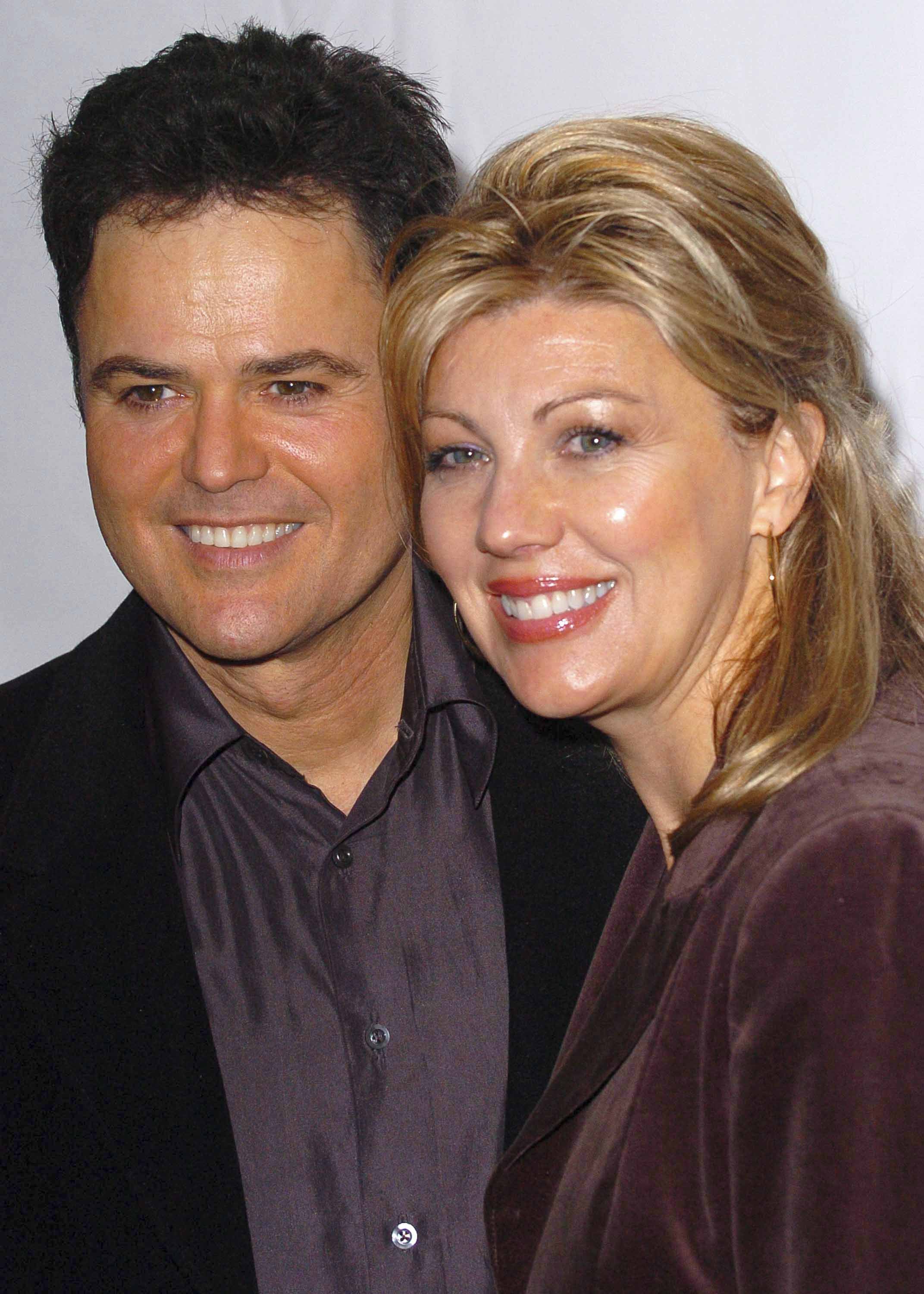 Donny Osmond with wife Debbie Osmond arrive at Tony Di Napoli restaurant for the after party celebrating Donny Osmond's opening night in Beauty and the Beast on September 24, 2006, in New York | Source: Getty Images
