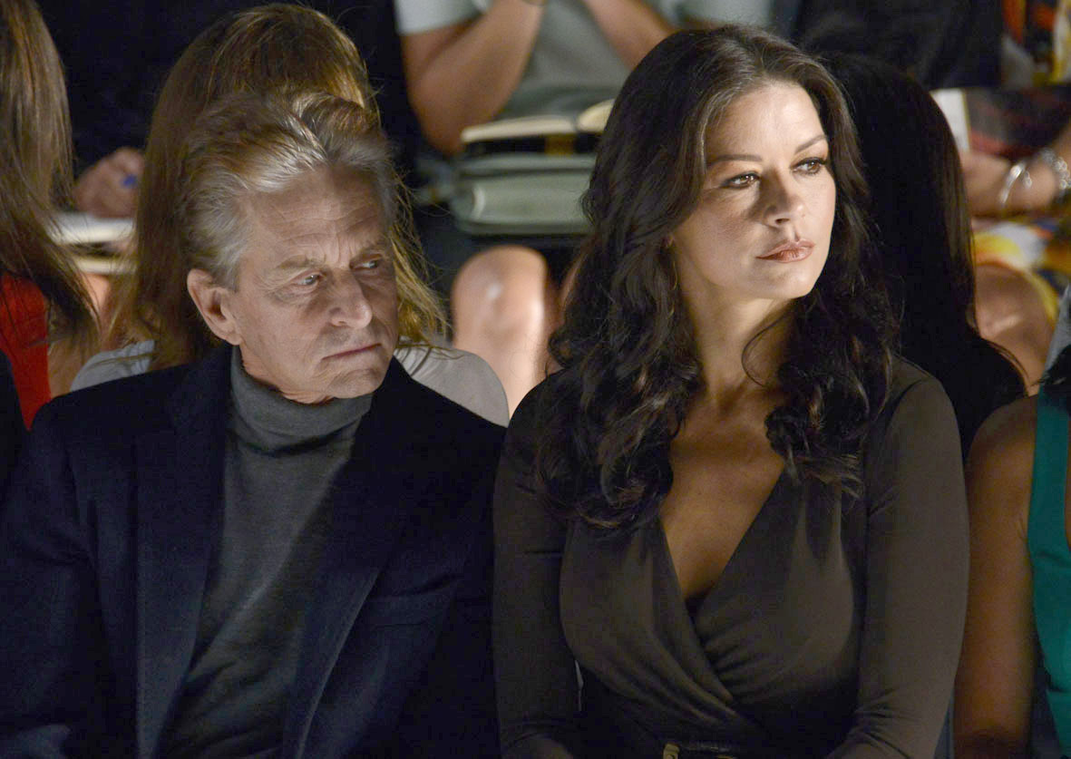Michael Douglas and Catherine Zeta Jones attend the Michael Kors show during the Spring 2013 Mercedes-Benz Fashion Week at The Theatre Lincoln Center, on September 12, 2012, in New York City. | Source: Getty Images