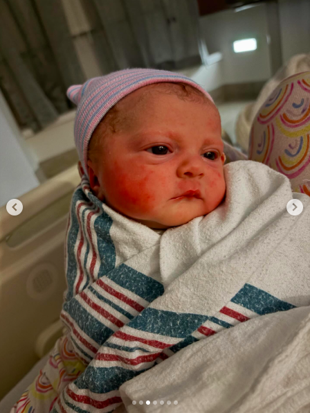 Mikey Moon Trainor looks on as the camera captures a photo of her. | Source: Instagram/meghantrainor and darylsabara