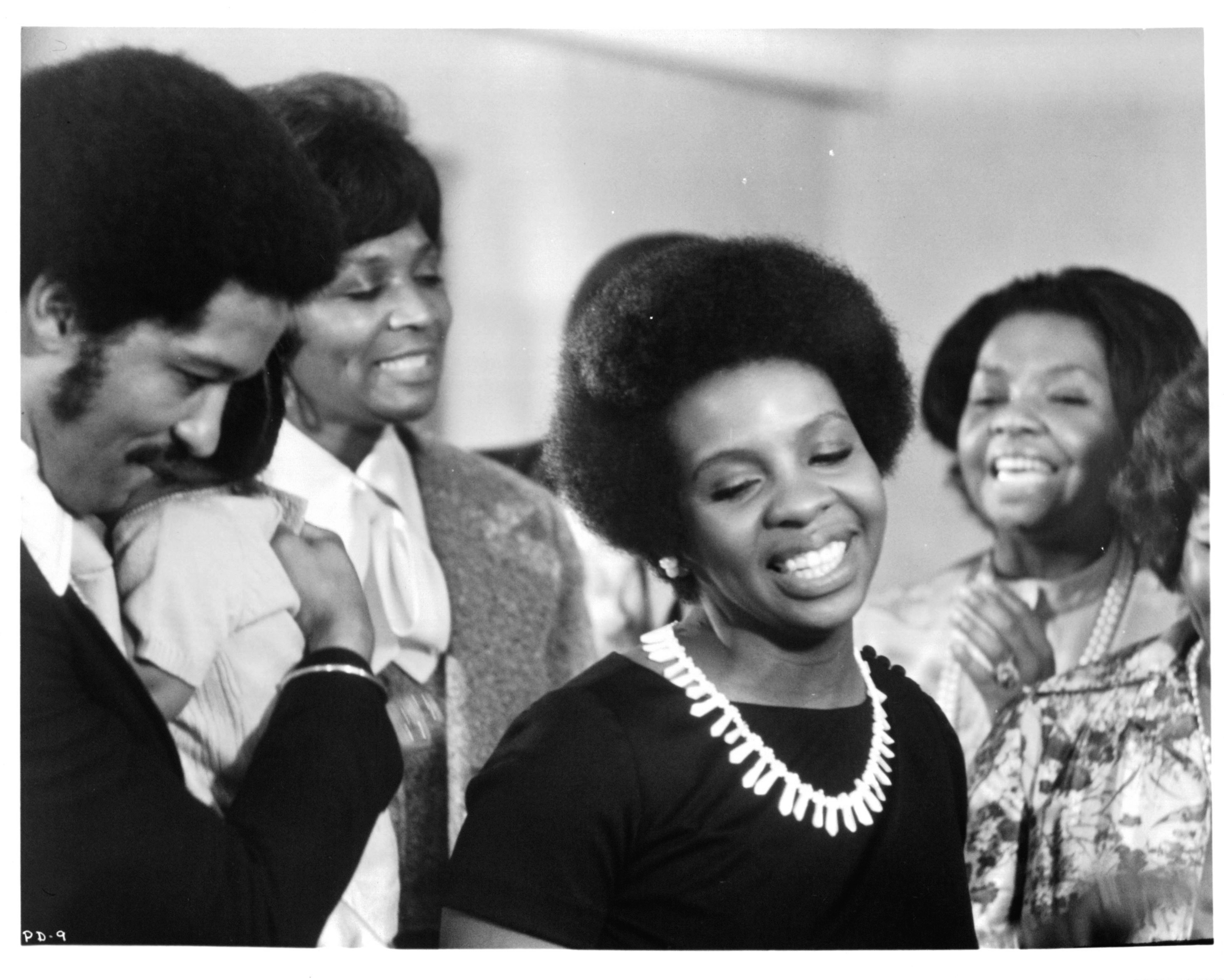 Barry Hankerson and Gladys Knight dance with friends in a scene from the film "Pipe Dreams," in 1976. | Source: Getty Images