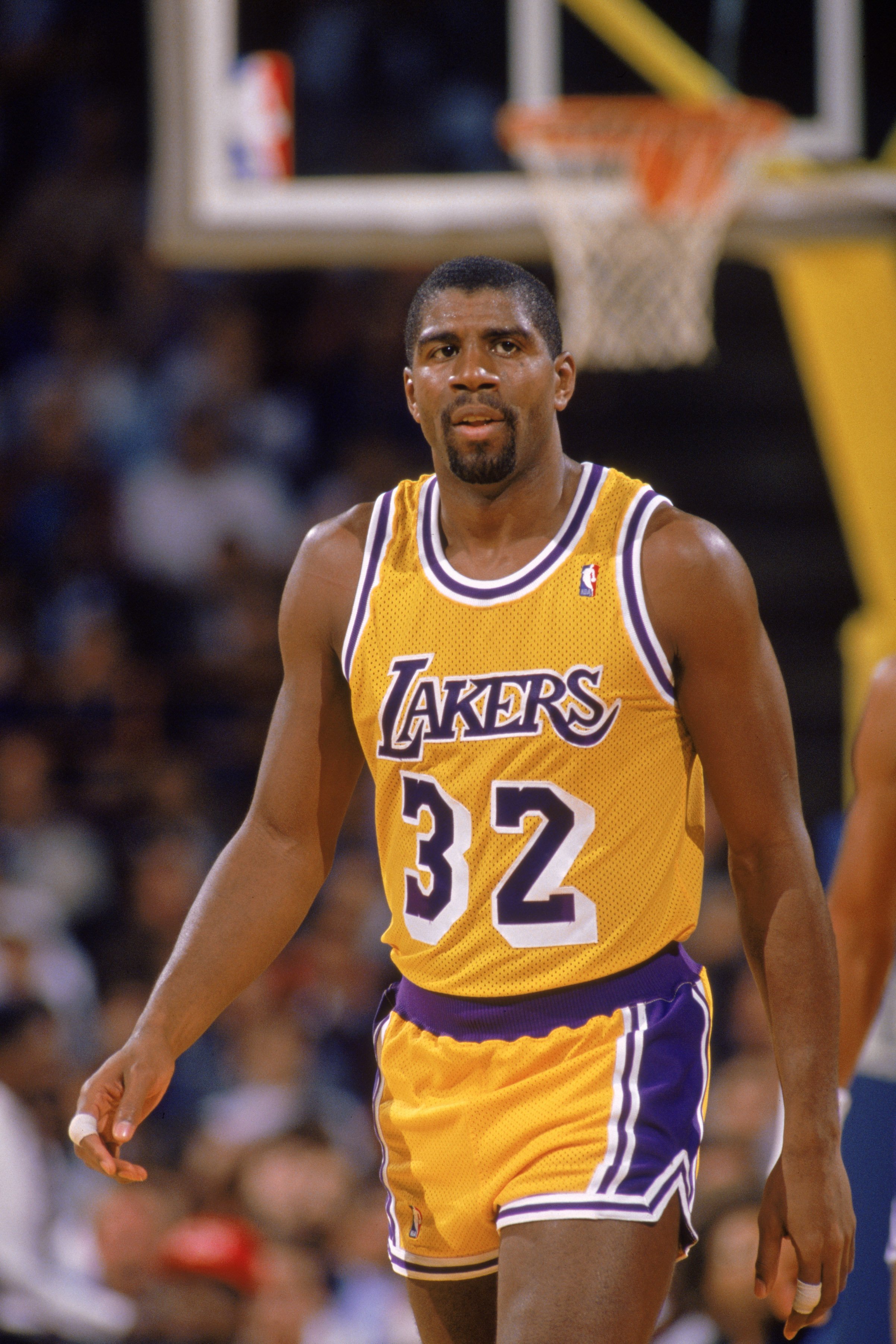 Magic Johnson #32 of the Los Angeles Lakers walks down the court during an NBA game at the Great Western Forum in Los Angeles, California in 1988 | Photo: Getty Images