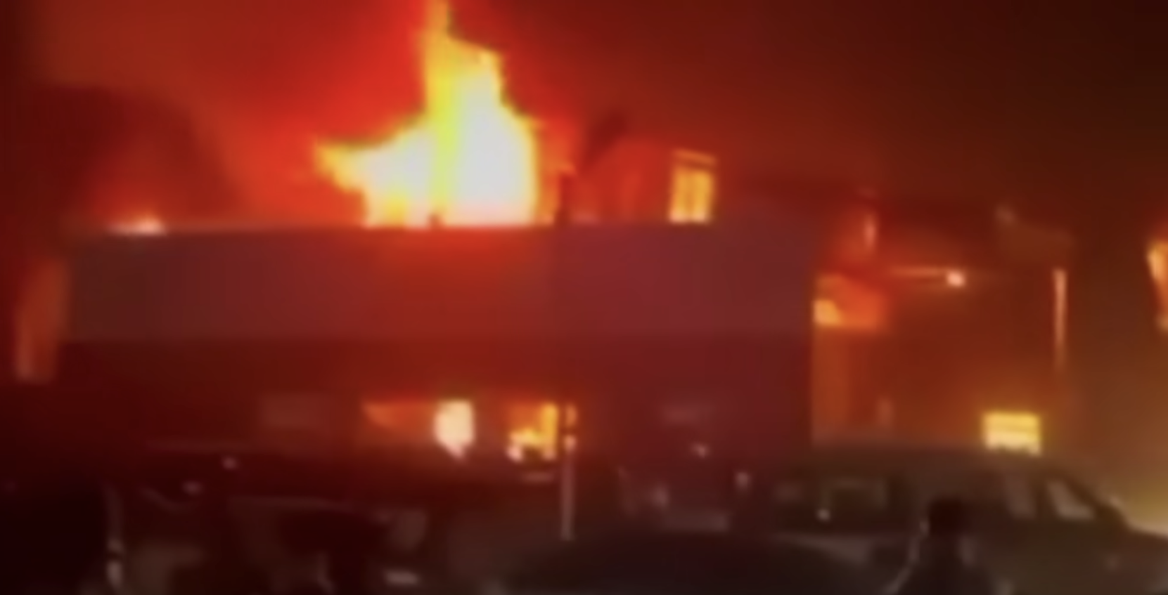 The wedding hall where Revan and Haneen Isho held their reception is seen burning down | Source: YouTube.com/@SkyNews