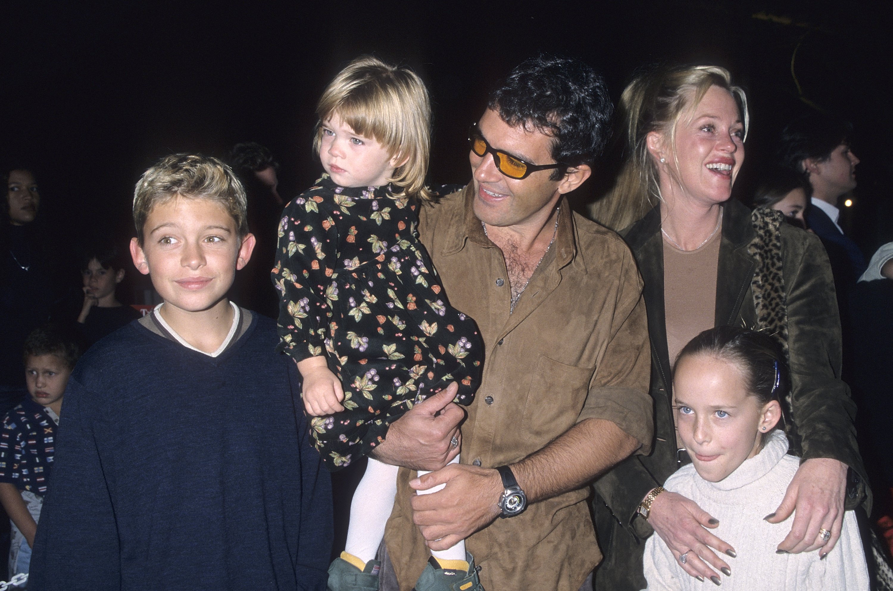 Actor Antonio Banderas, actress Melanie Griffith, daughter Stella Banderas, Melanie's son Alexander Bauer and Melanie's daughter Dakota Johnson attend "The Lion King 2: Simba's Pride" Westwood Premiere on October 20, 1998 at the Wadsworth Theater in Westwood, California | Source: Getty Images