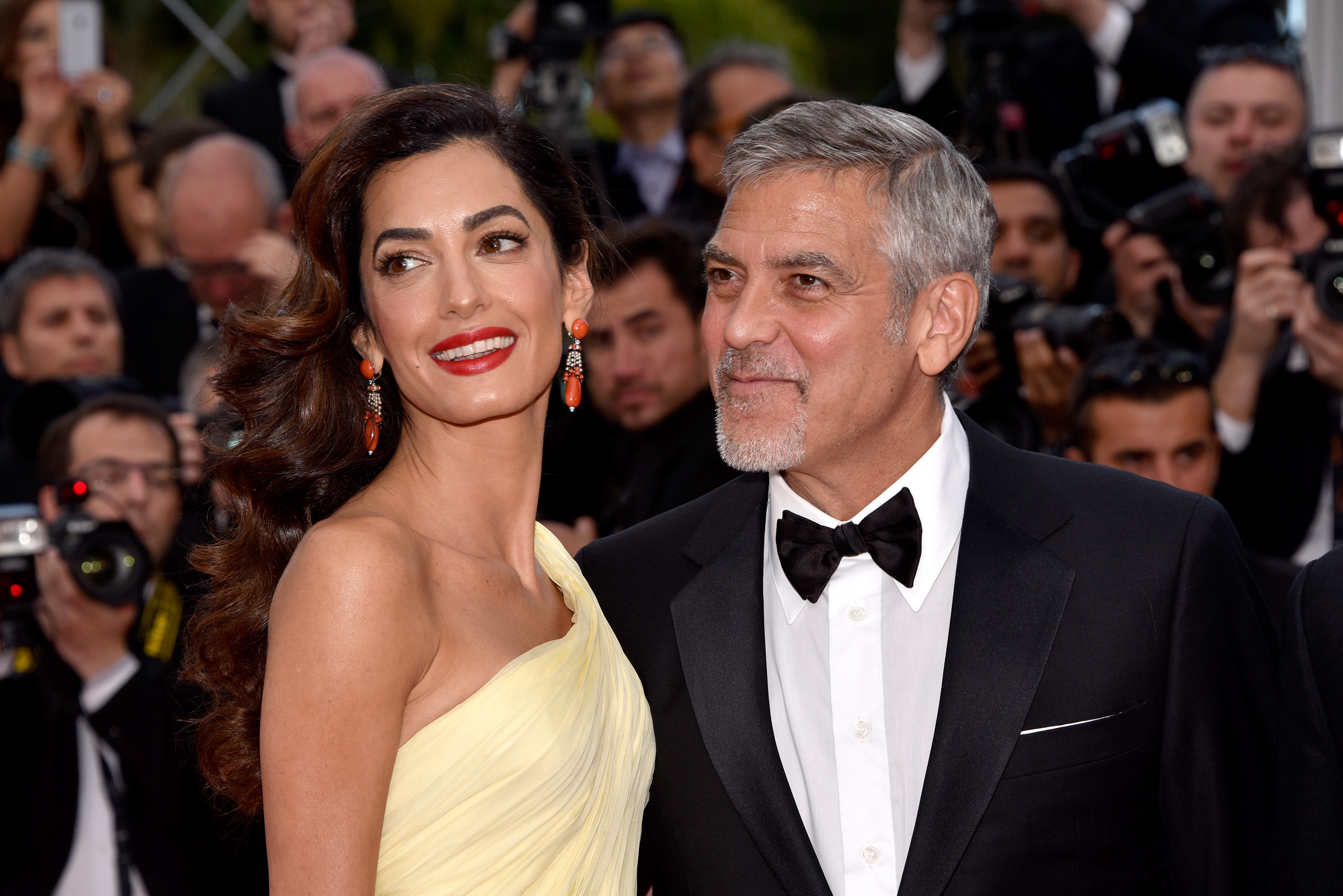 Amal and George Clooney at the premiere of "Money Monster" during the 69th annual Cannes Film Festival in Cannes, France on May 12, 2016 | Source: Getty Images