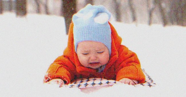 A baby crying in the snow | Source: Shutterstock