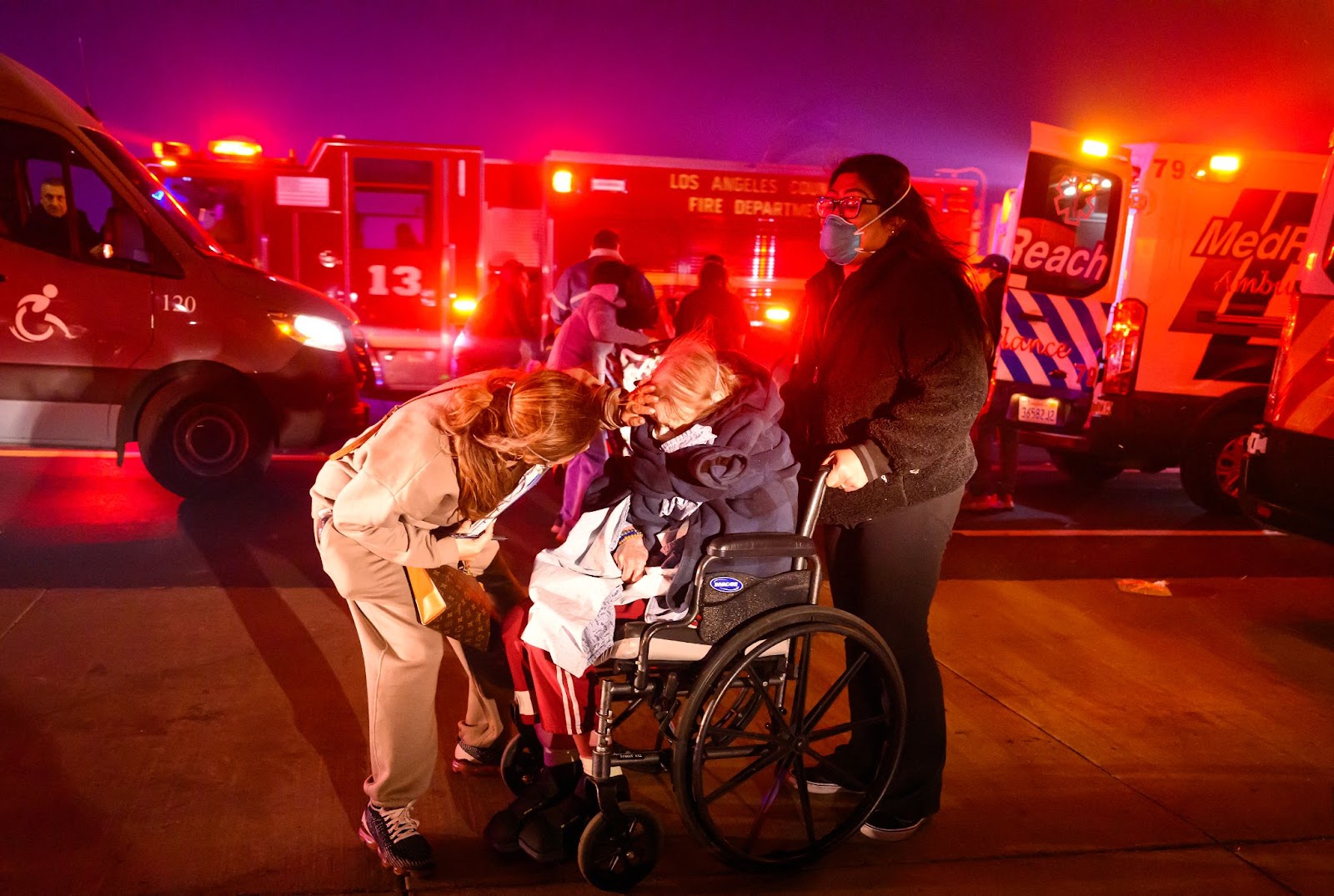 Velma Wright, age 102, photographed being evacuated from a care facility as embers and flames approach during the Eaton fire in Pasadena, California, on January 7, 2025. | Source: Getty Images