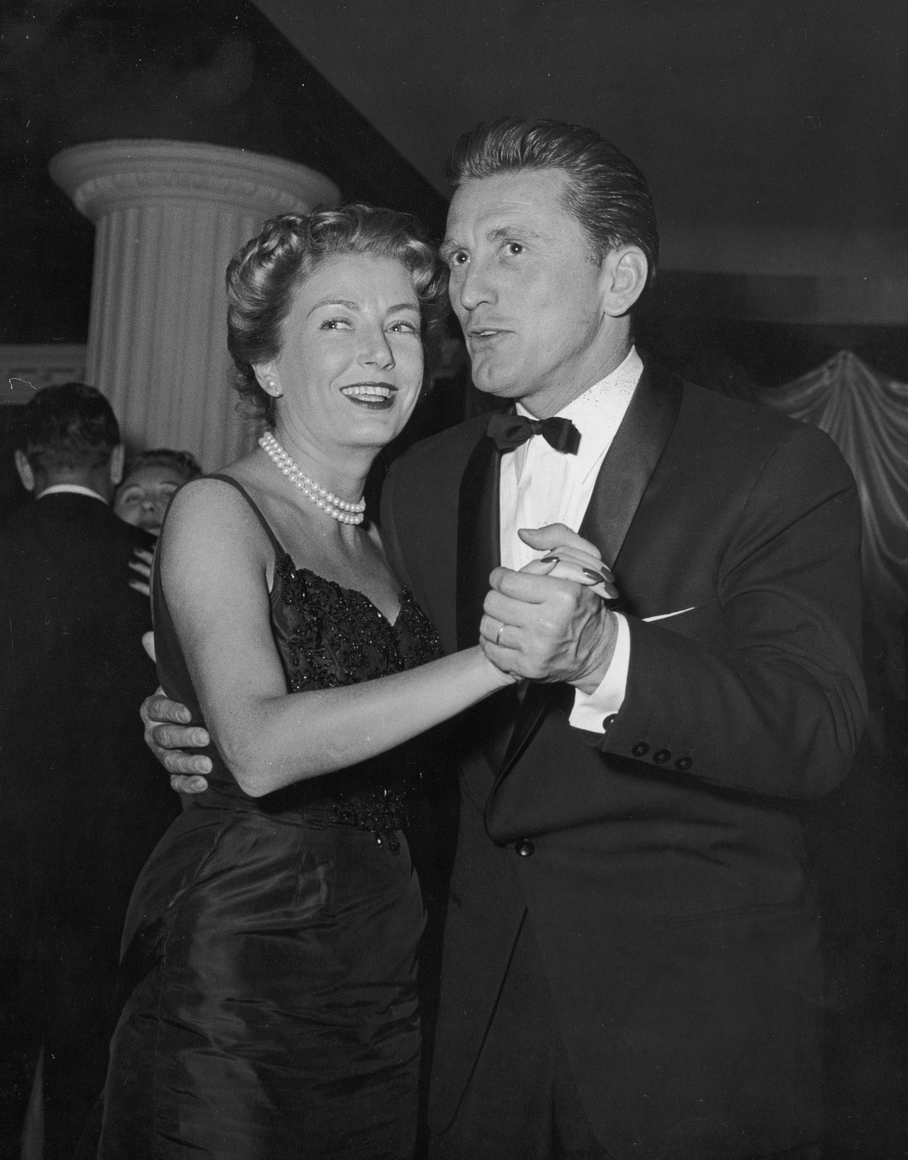 Kirk Douglas and his wife, film producer Anne Buydens, dancing at a club in New York City in 1955. | Source: Getty Images