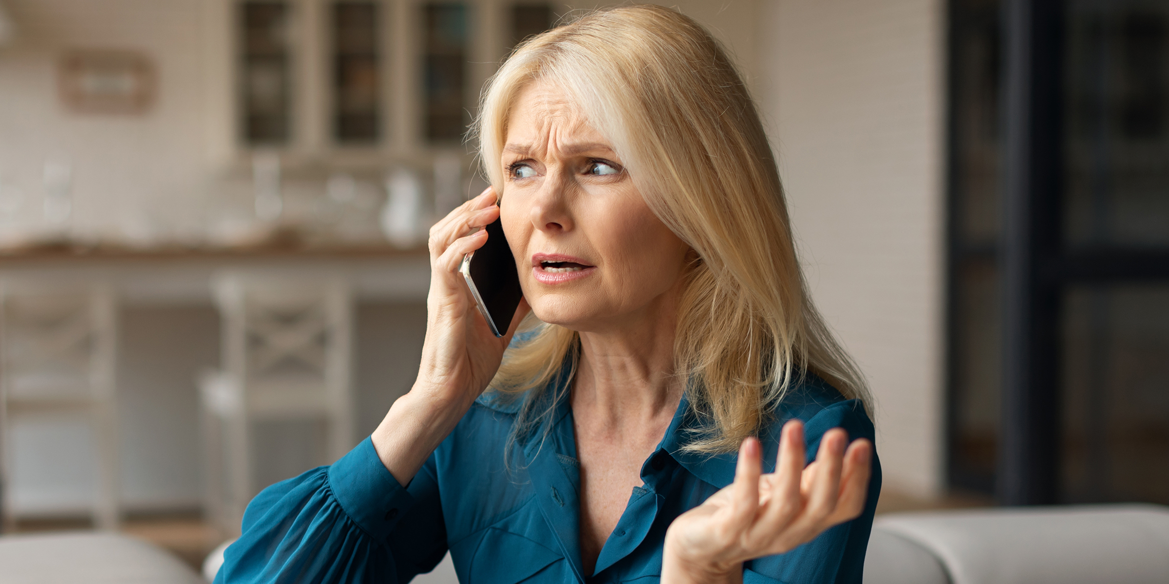 Woman talks on the phone | Source: Shutterstock