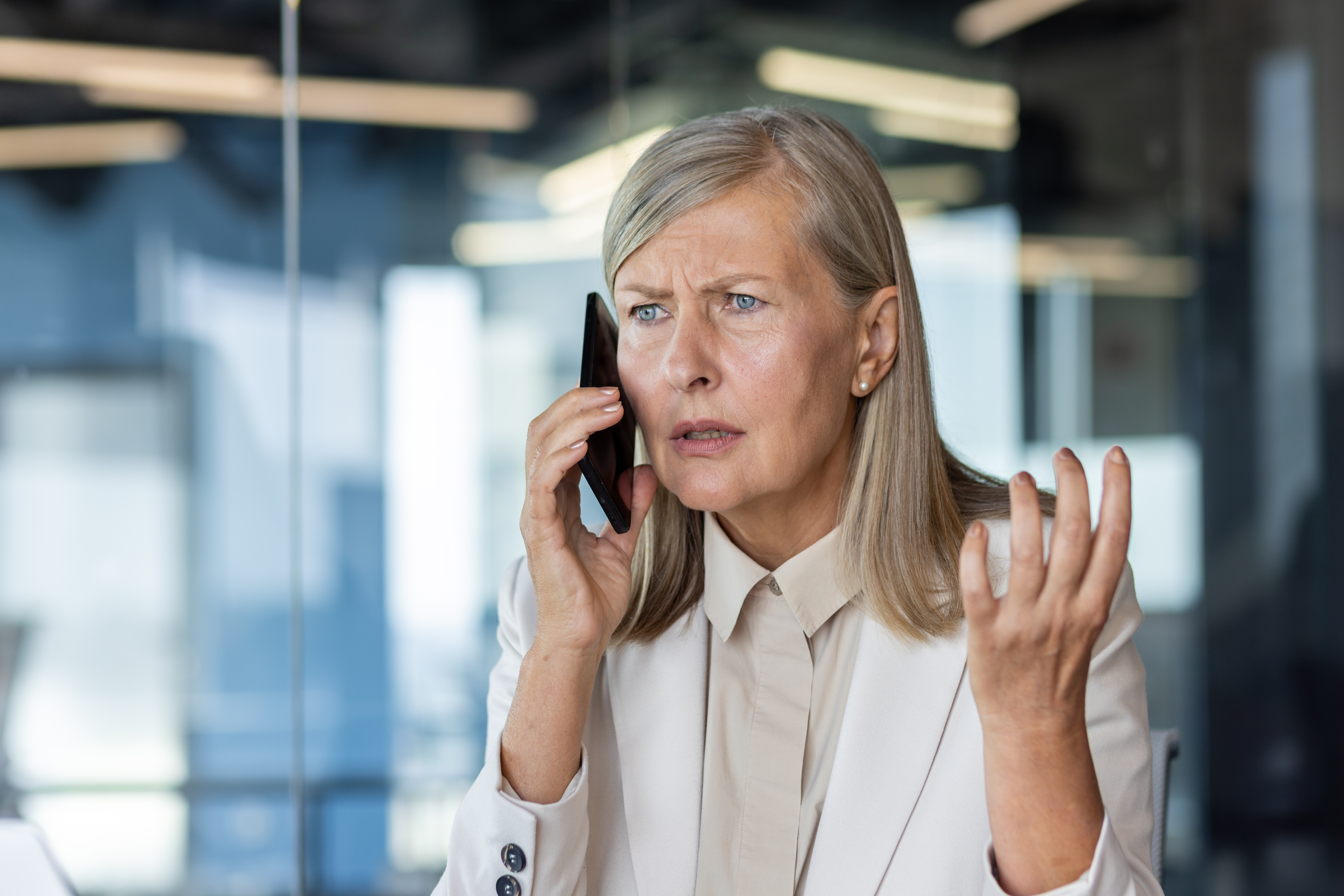 An upset older woman talking to someone on the phone | Source: Getty Images