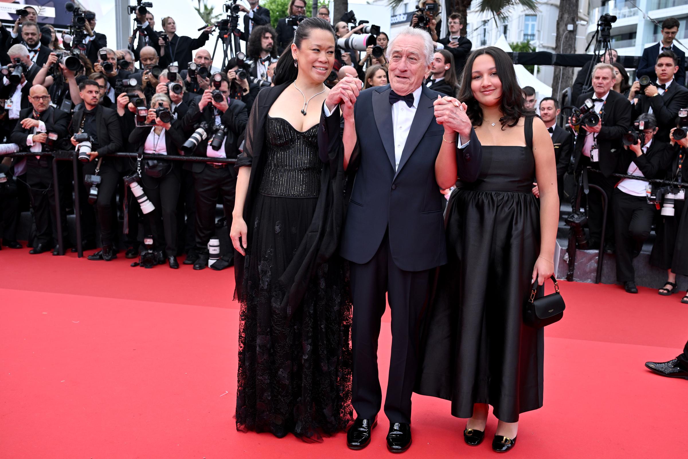 Tiffany Chen, Robert De Niro, and Helen Grace De Niro attend the red carpet at the 78th annual Cannes Film Festival at Palais des Festivals on May 13, 2025, in France | Source: Getty Images