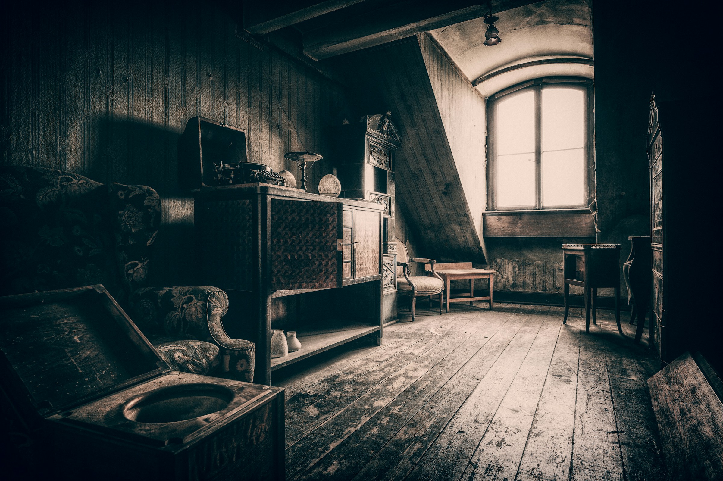 A dark attic with furniture | Source: Unsplash