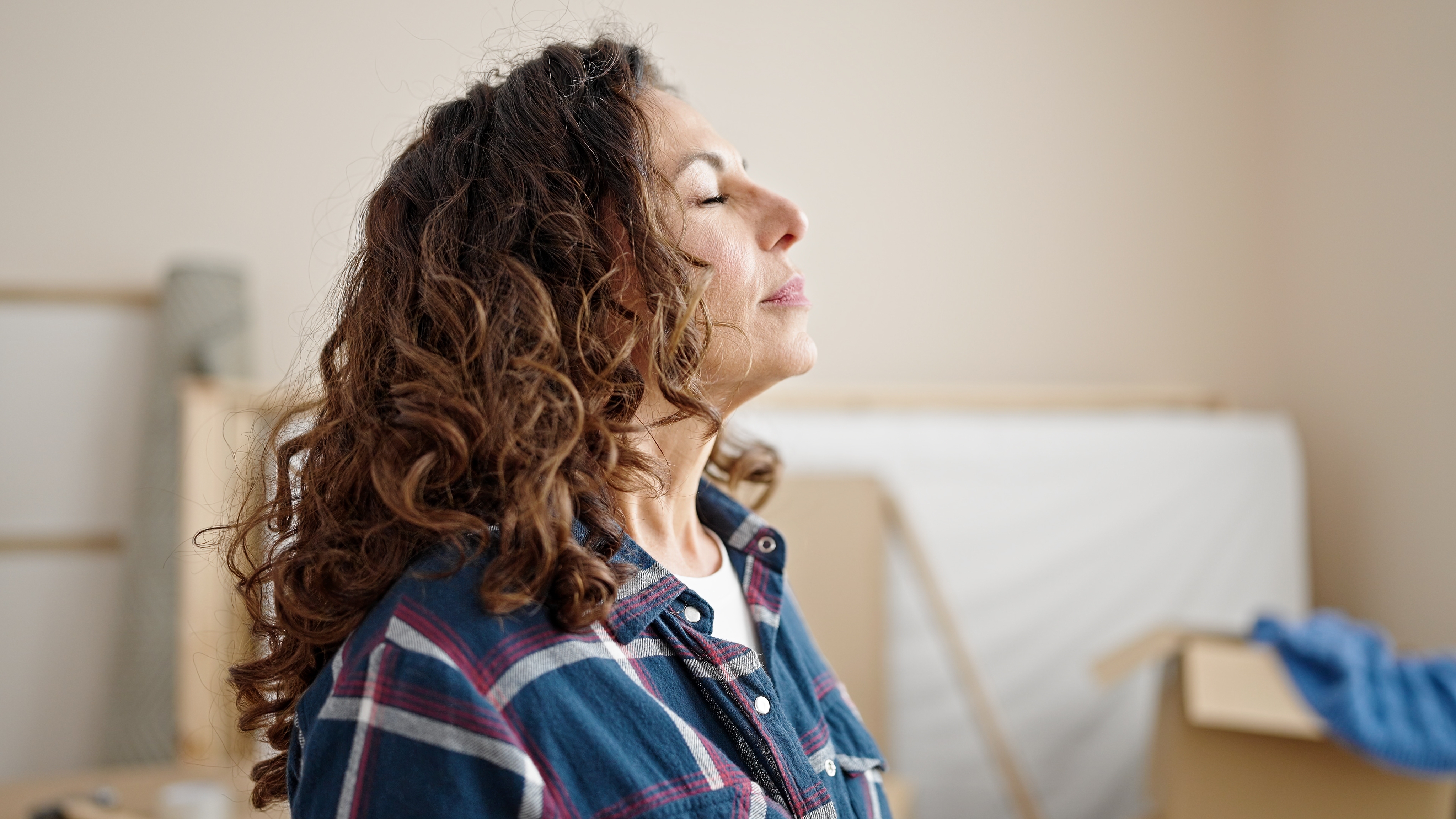 Woman breathing with eyes closed | Source: Shutterstock