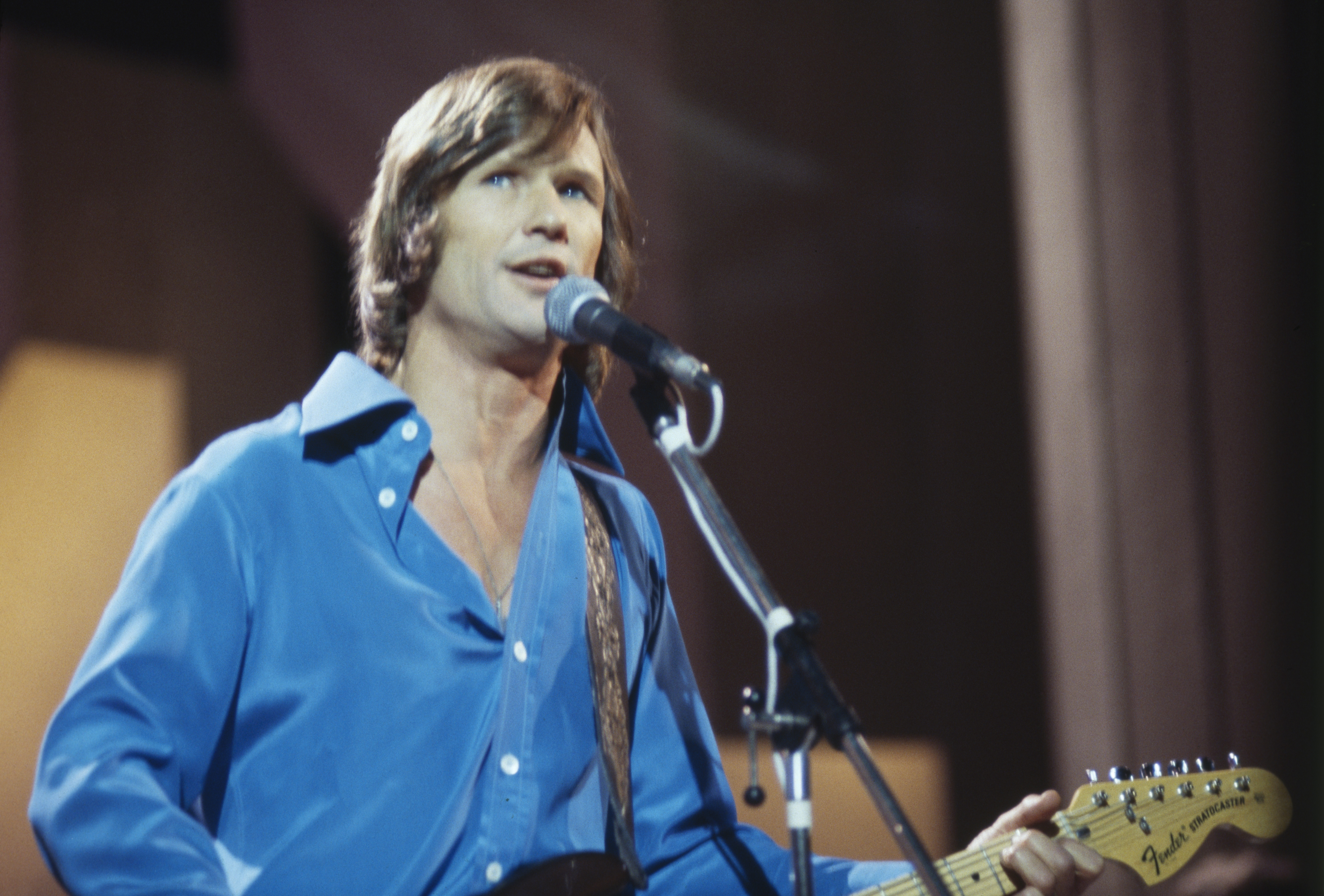 Kris Kristofferson during a concert performance, circa 1970 | Source: Getty Images