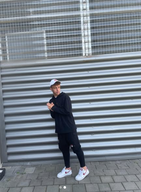 Luca Manolache posing on a street, from a post dated October 22, 2021 | Source: Instagram/manolache_luca10