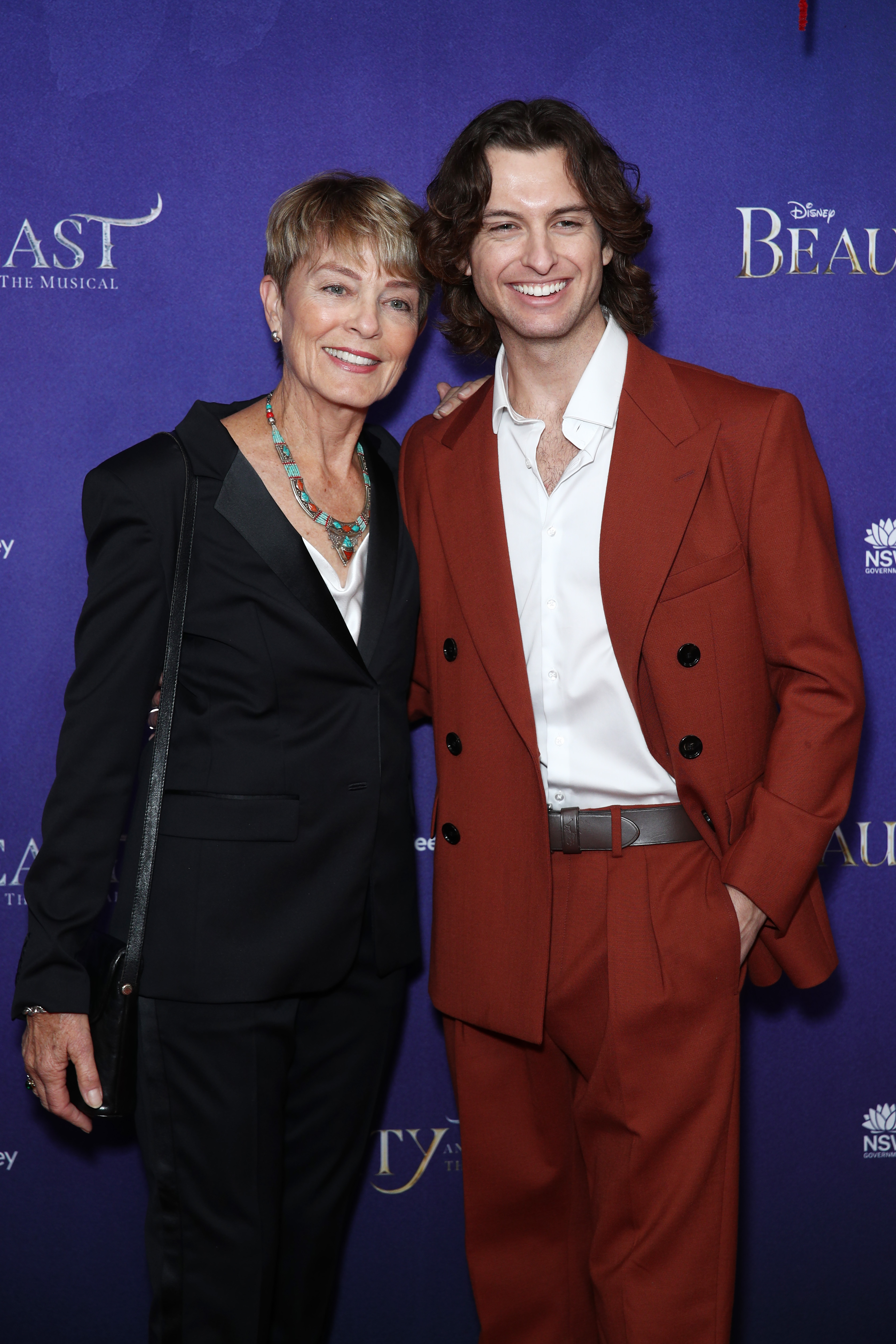 Lachlan's mother, Sarie Kessler, and his brother, Cameron Robbie, pose at the opening night of "Beauty & The Beast" at the Capitol Theatre on June 22, 2023 in Sydney, Australia | Source: Getty Images