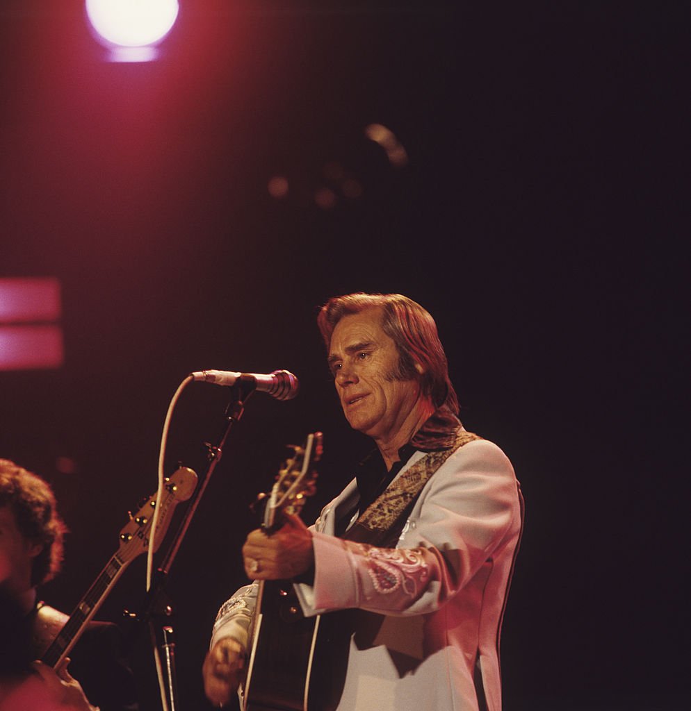 George Jones performs on stage at the Country Music Festival held at Wembley Arena, London in April 1981. | Source: Getty Images