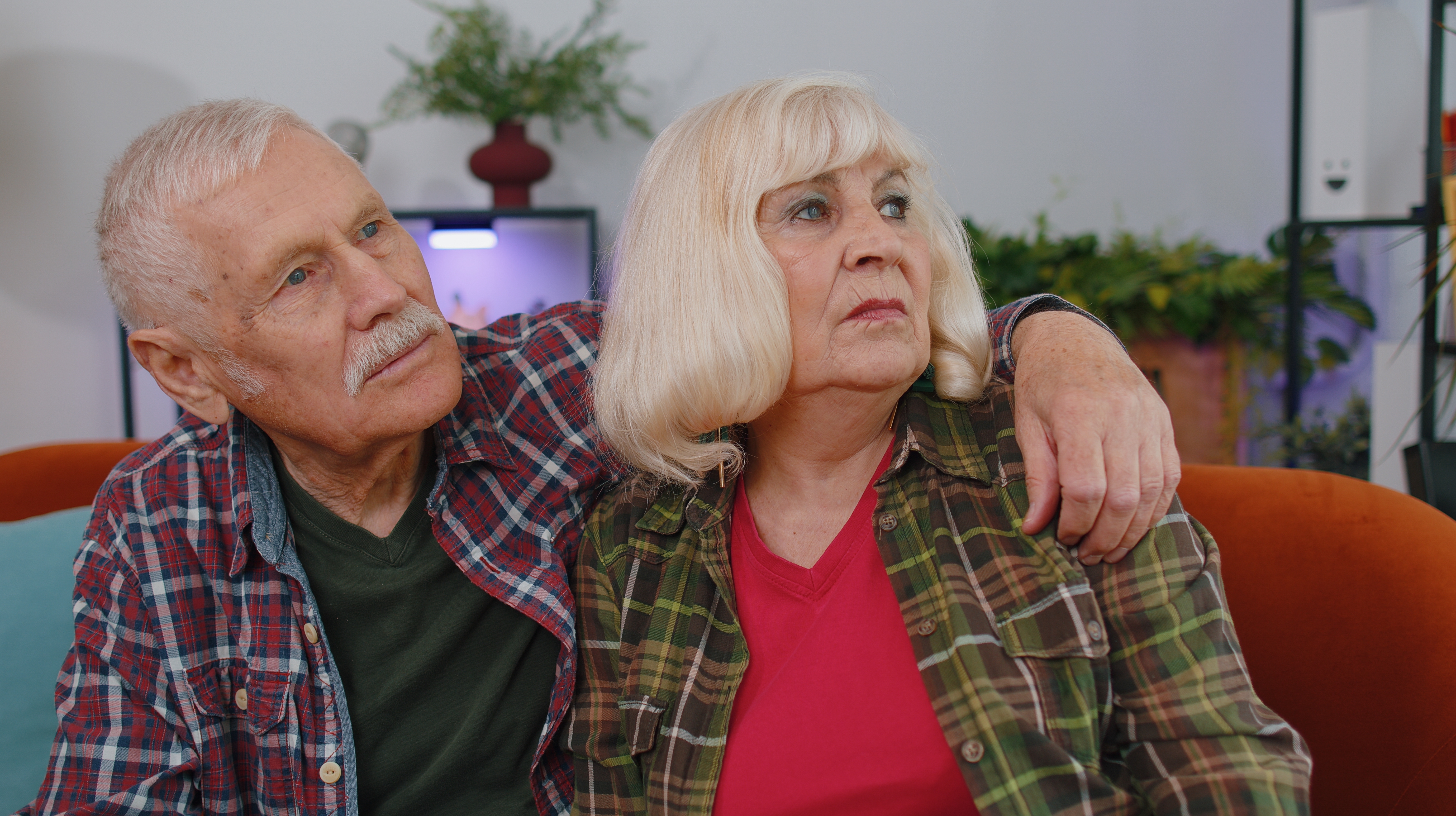 Annoyed grandparents sitting at home | Source: Shutterstock