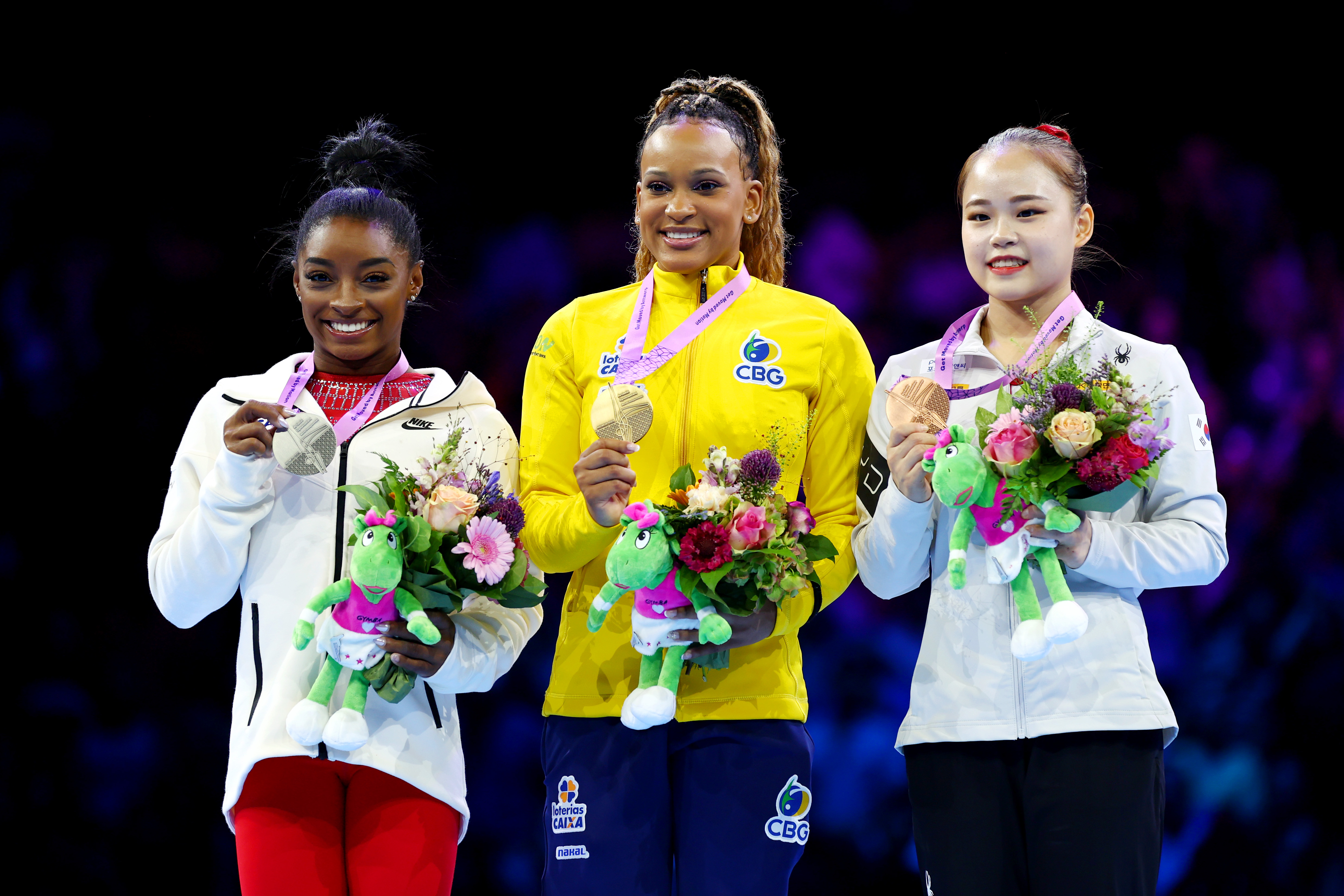 Silver medalist Simone Biles of Team United States, gold medalist Rebeca Andrade of Team Brazil and bronze medalist Seojeong Yeo of Team Republic of Korea pose for a photo at the 2023 Artistic Gymnastics World Championships at Antwerp Sportpaleis on October 07, 2023 in Belgium | Source: Getty Images