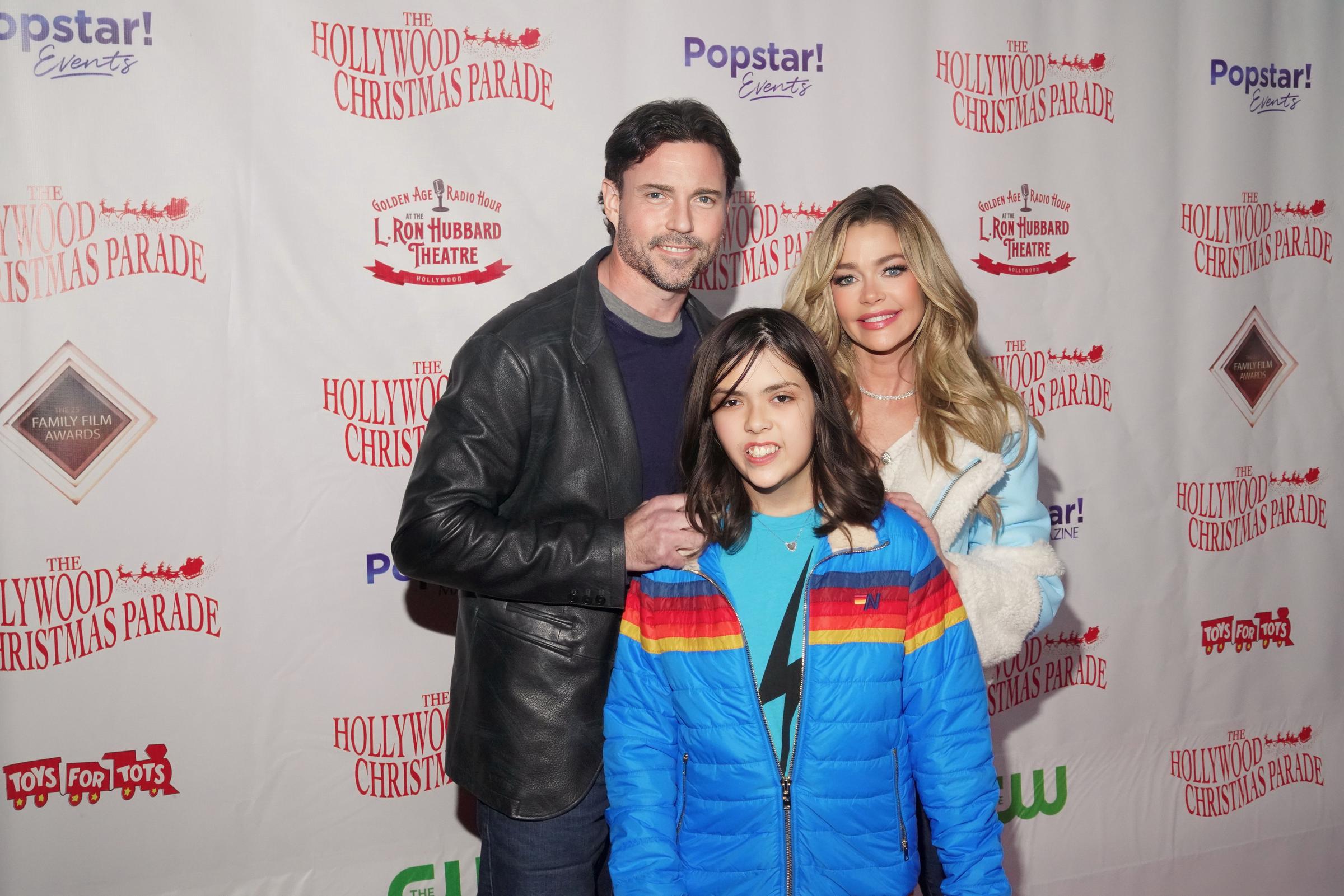 Aaron Phypers, Eloise Joni and Denise Richards attend 91st Hollywood Christmas Parade on November 26, 2023 in Hollywood, California | Source: Getty Images