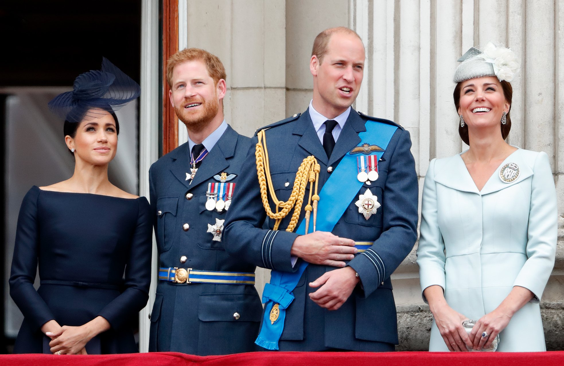 Meghan Markle, Prince Harry, Prince William and Kate Middleton observe a flypast to mark the Royal Air Force Centenary at the Buckingham Palace on July 10, 2018 | Photo: Getty Images
