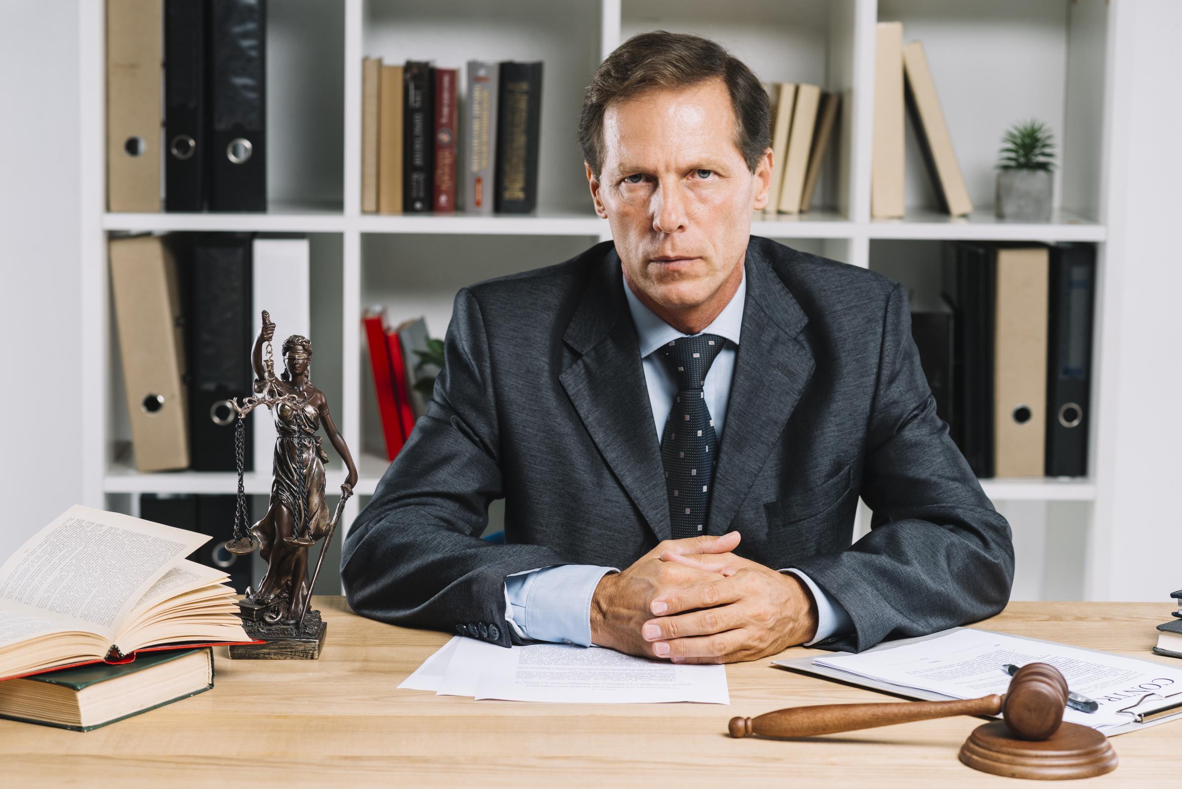 A senior man in suit looking serious | Source: Freepik