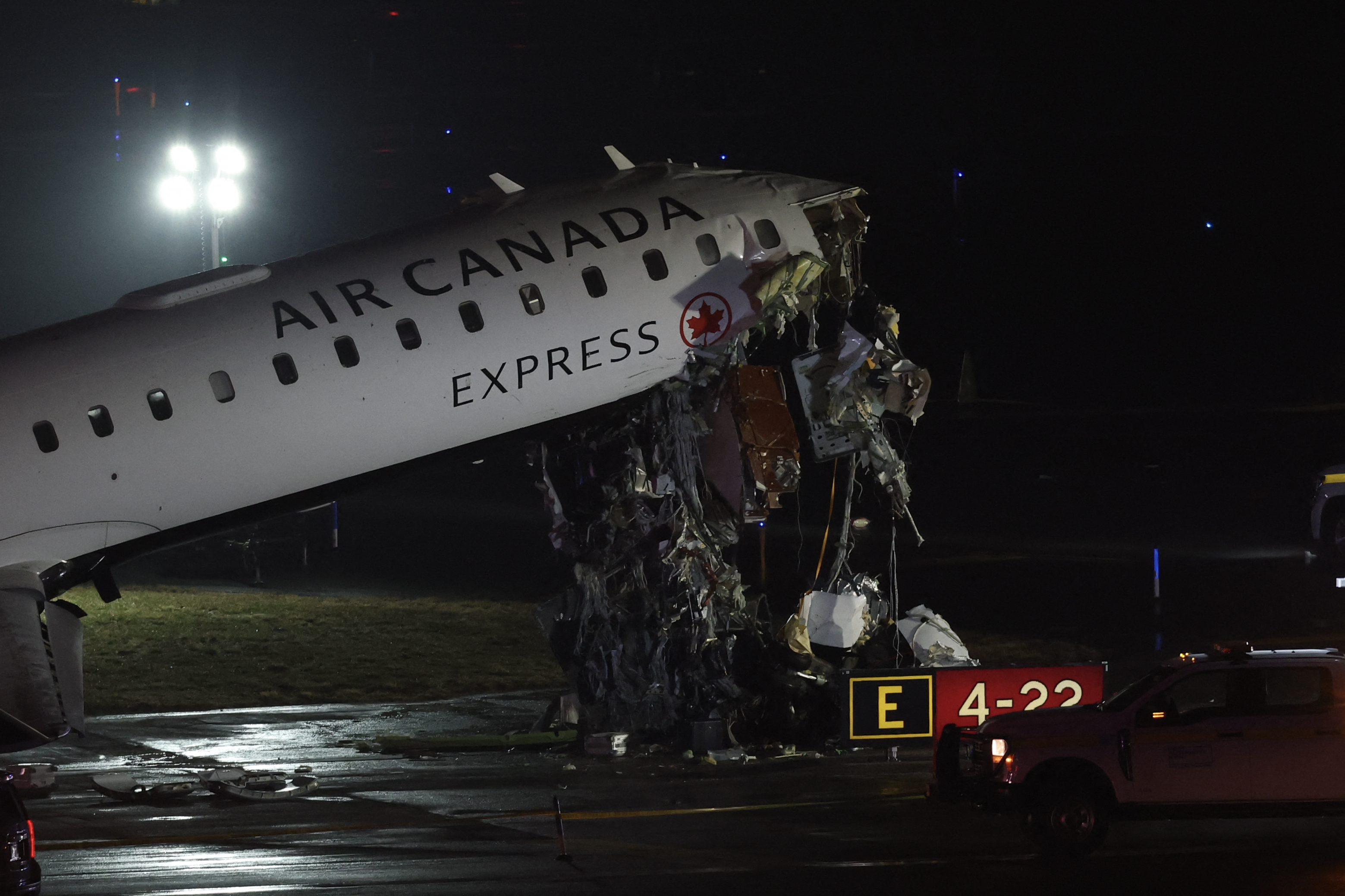 An Air Canada Express CRJ-900 sits on the runway after colliding with a Port Authority fire truck at LaGuardia Airport in New York, on March 23, 2026.