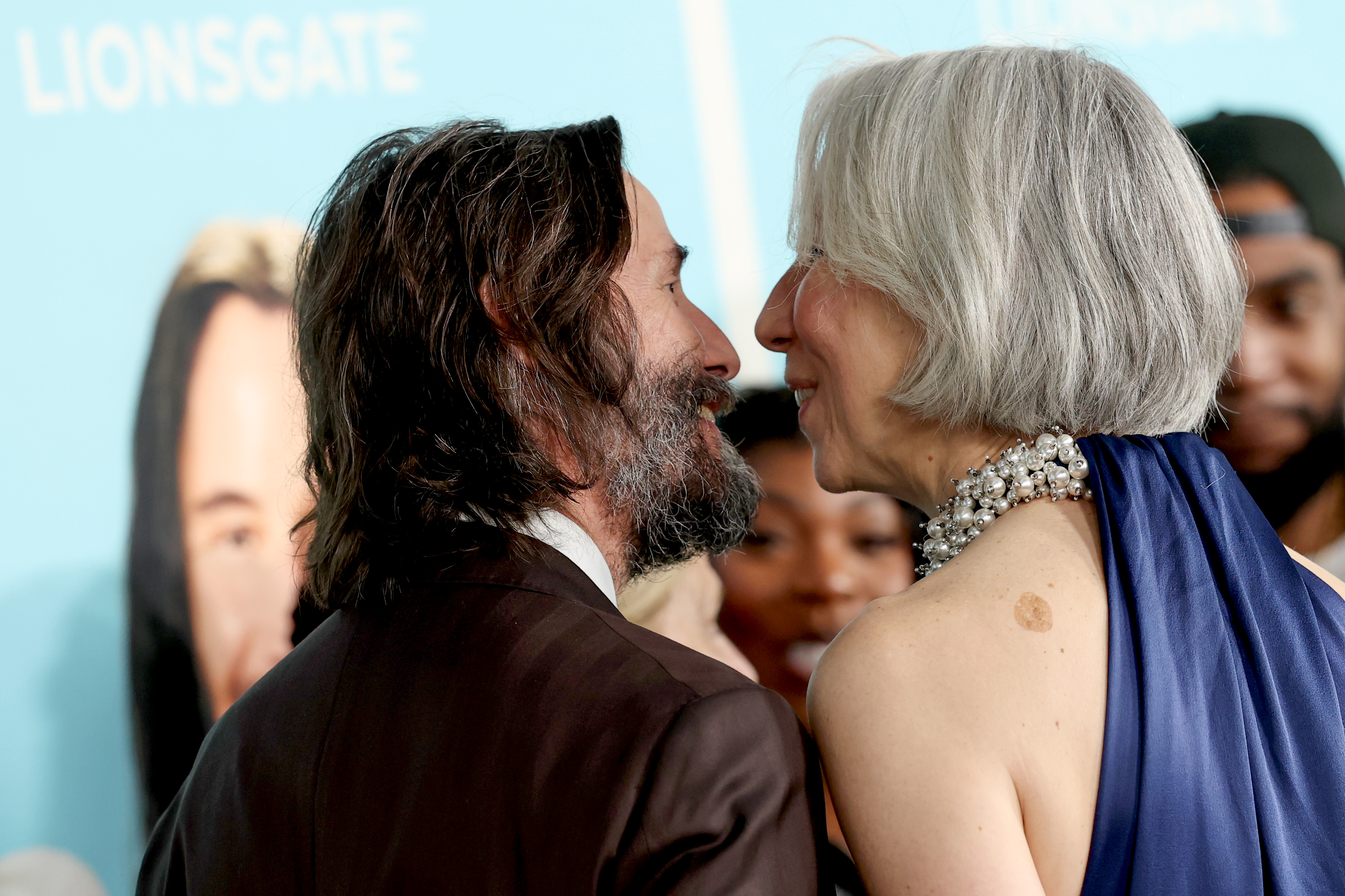 A close-up of Keanu Reeves and Alexandra Grant. | Source: Getty Images