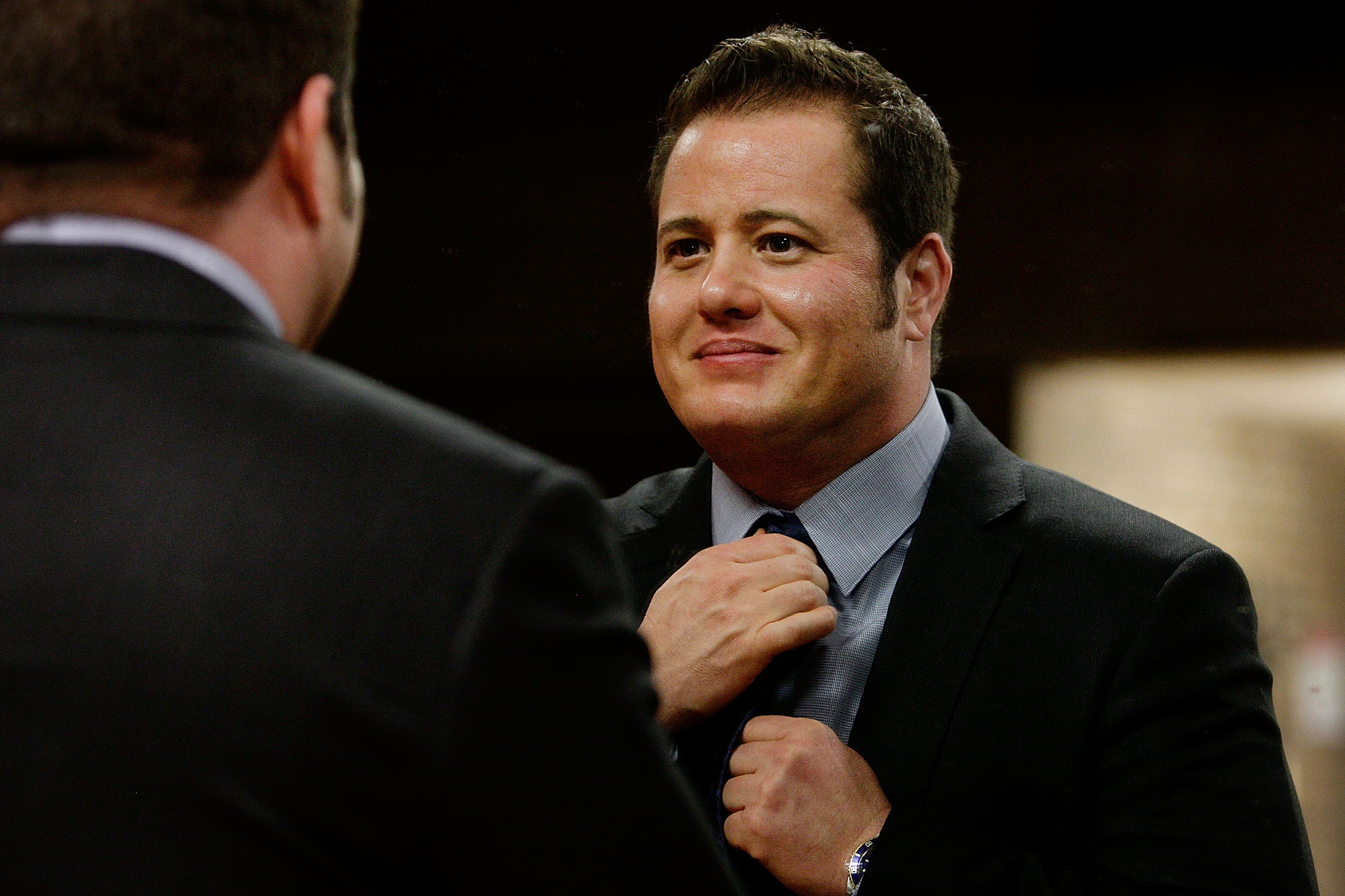 Chaz Bono adjusts his tie prior to appearing on stage at the Sydney Gay & Lesbian Mardi Gras in Australia, on February 26, 2014. | Source: Getty Images