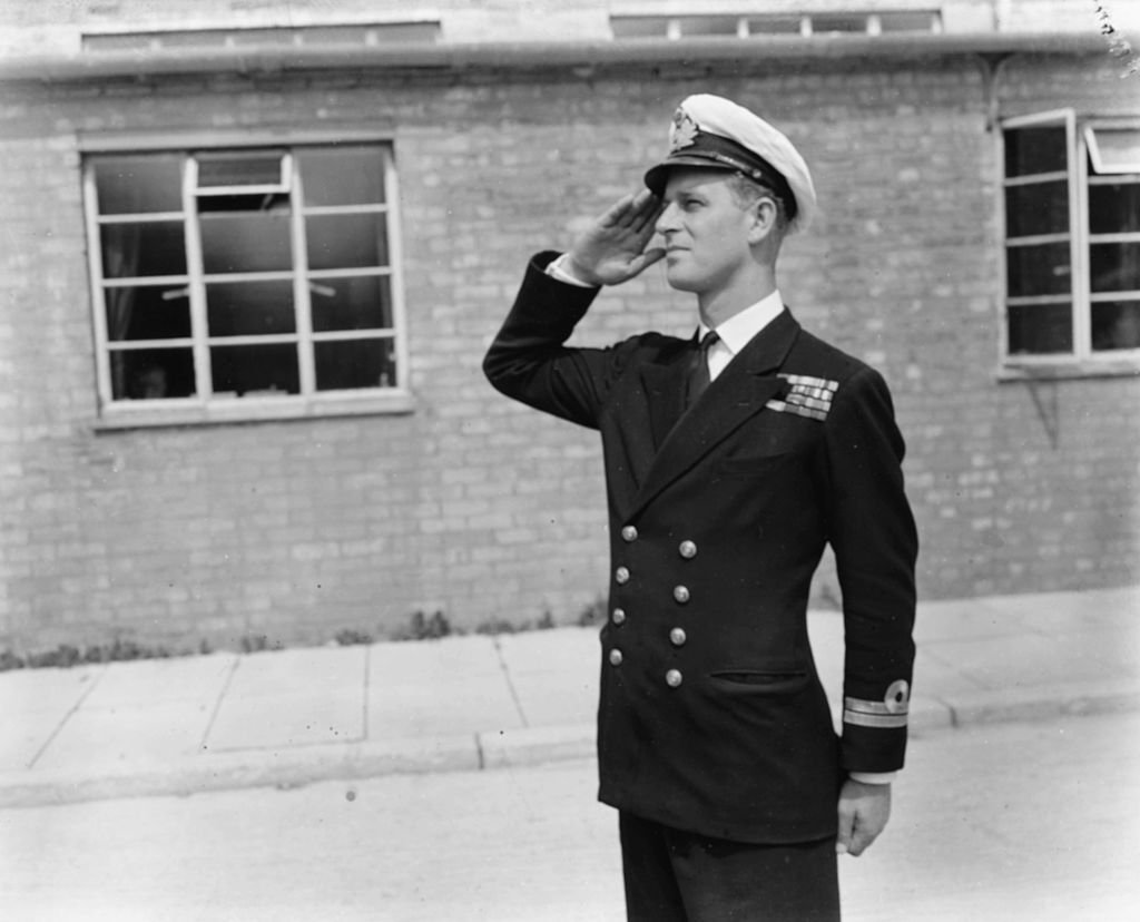 Philip Mountbatten, prior to his marriage to Princess Elizabeth, saluting as he resumes his attendance at the Royal Naval Officers School. | Source: Getty Images