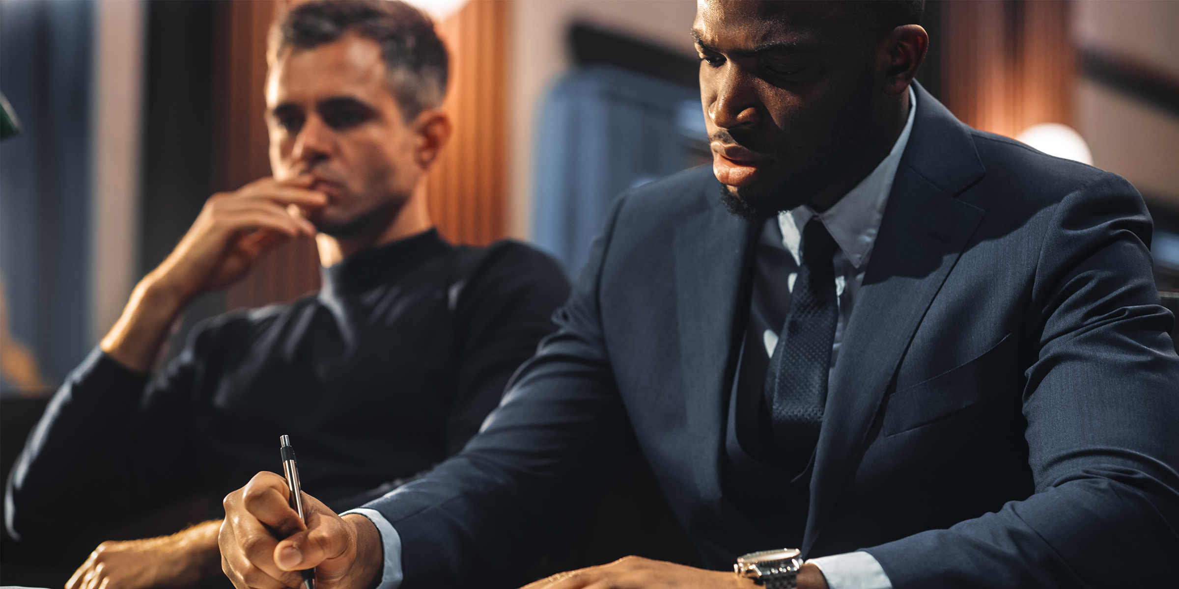 A lawyer and defendant in a courtroom | Source: Shutterstock