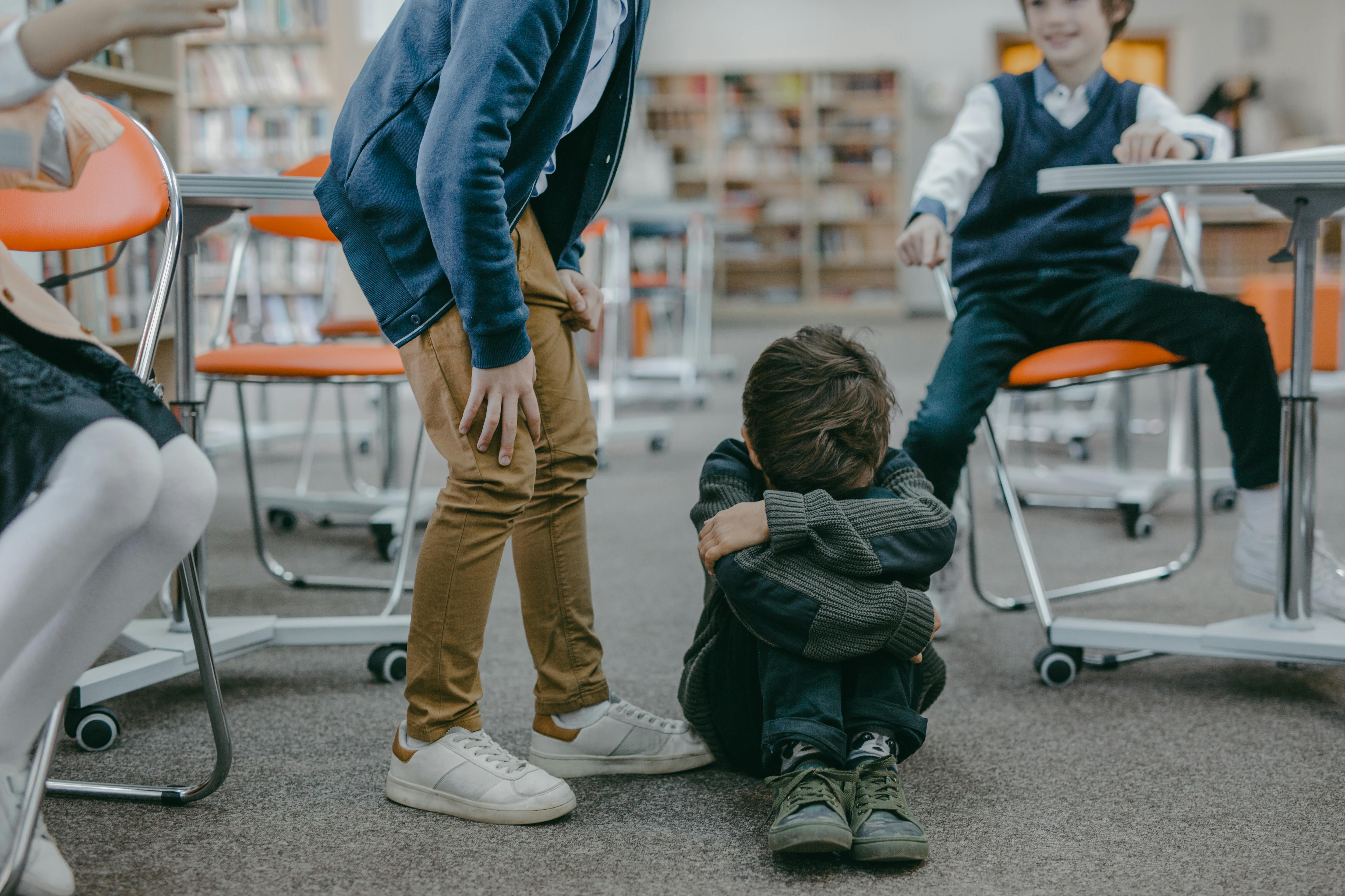 A boy bullying another child at school | Source: Pexels