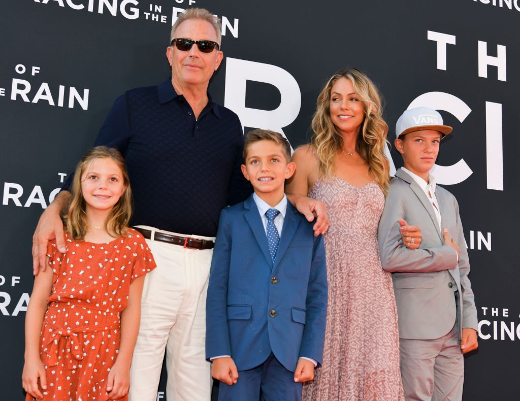 (L-R) Grace Avery Costner, Kevin Costner, Hayes Logan Costner, Christine Baumgartner, and Cayden Wyatt Costner attend the premiere of 20th Century Fox's "The Art of Racing in the Rain" at El Capitan Theatre on August 01, 2019 in Los Angeles, California | Source: Getty Images