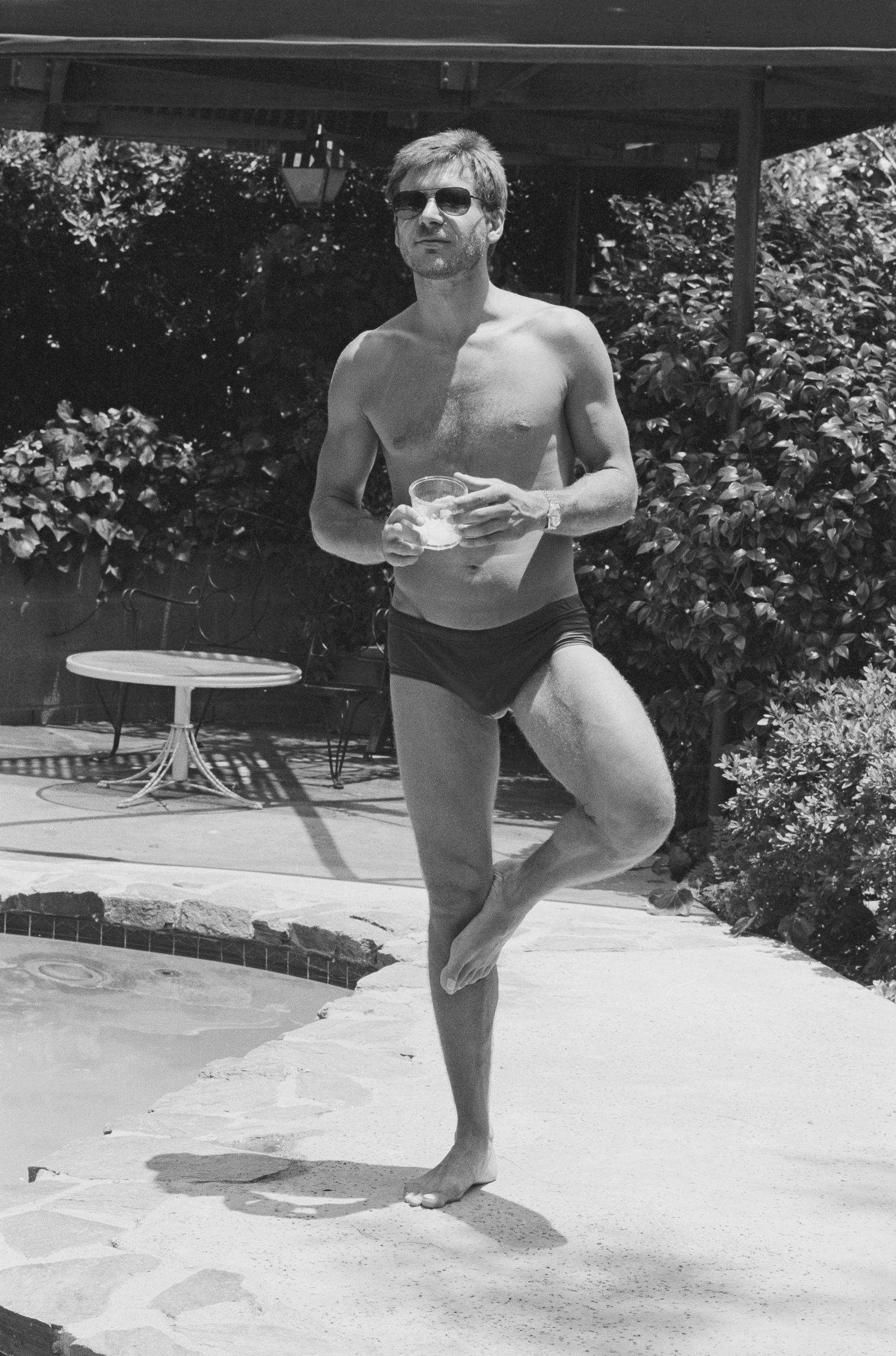 Harrison Ford is the picture of laid-back confidence in this classic black-and-white snap, taken at his Los Angeles home.