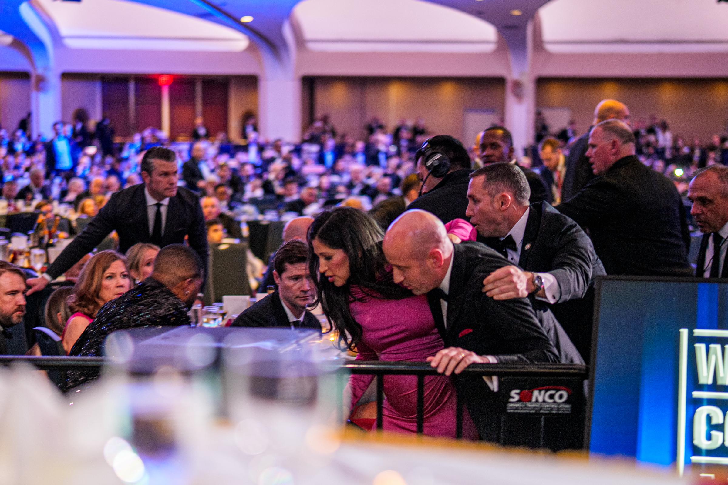 Pete Hegseth stands as Stephen Miller and Katie Miller are taken out of the ballroom by security agents during a shooting incident at the White House Correspondents' Dinner at Washington Hilton on April 25, 2026, in Washington, DC | Source: Getty Images